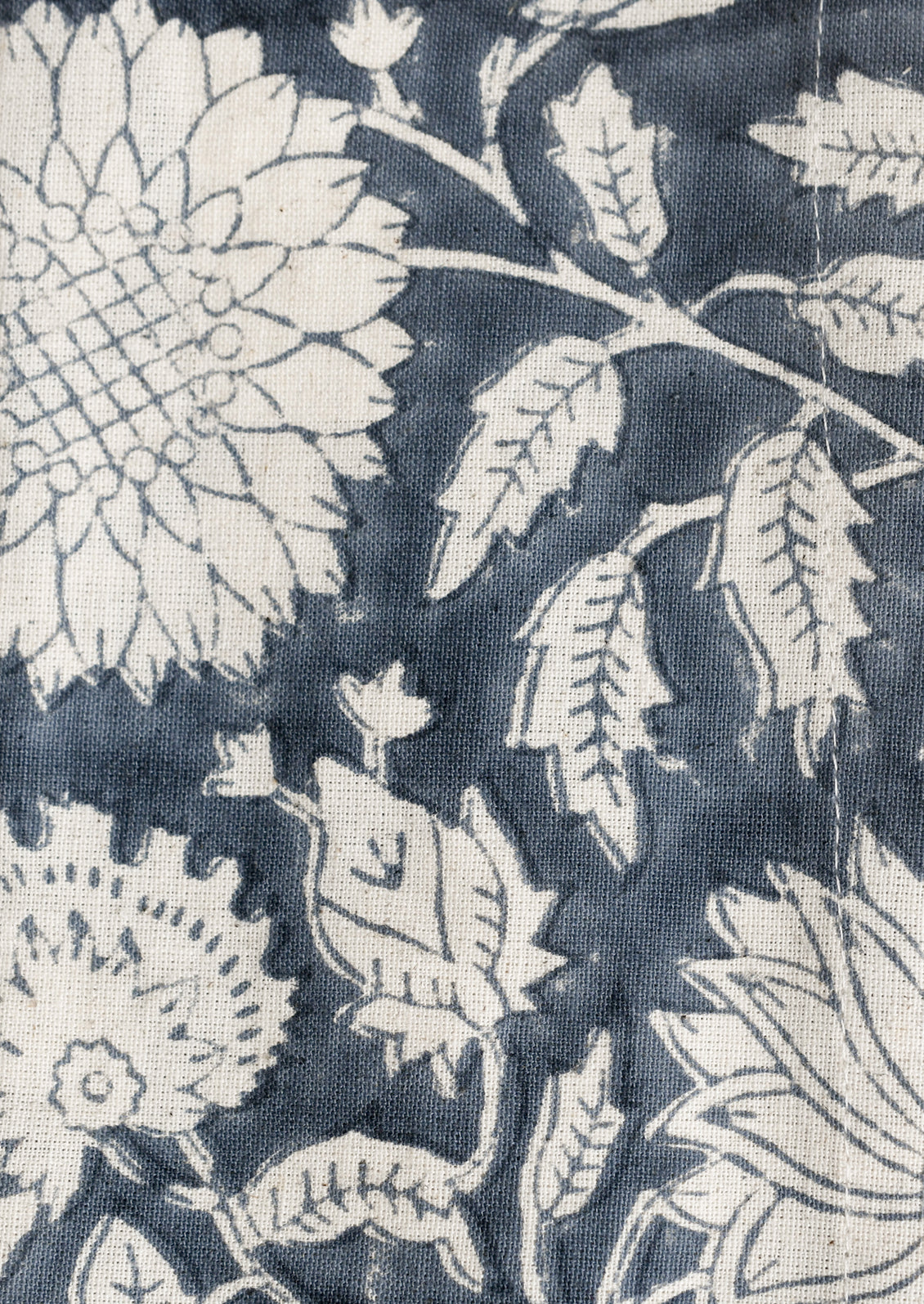A pair of floral patterned napkins in steel blue and white.