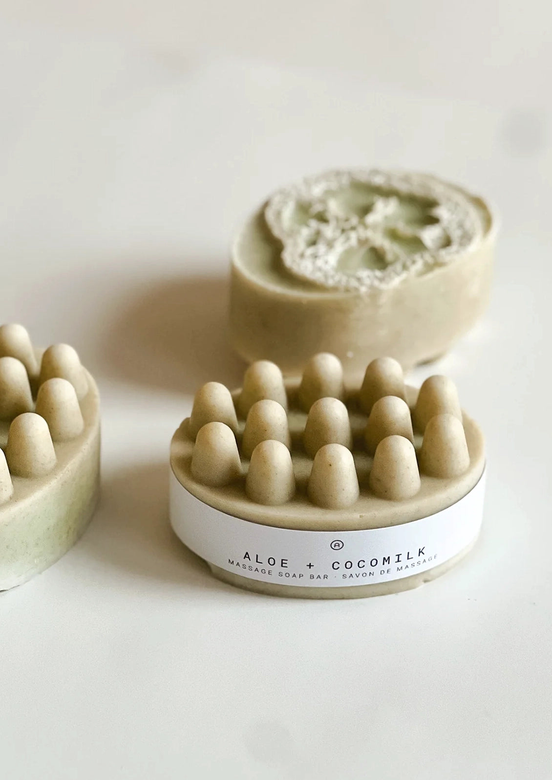 Aloe coconut milk soap bar with exfoliating scrubber.