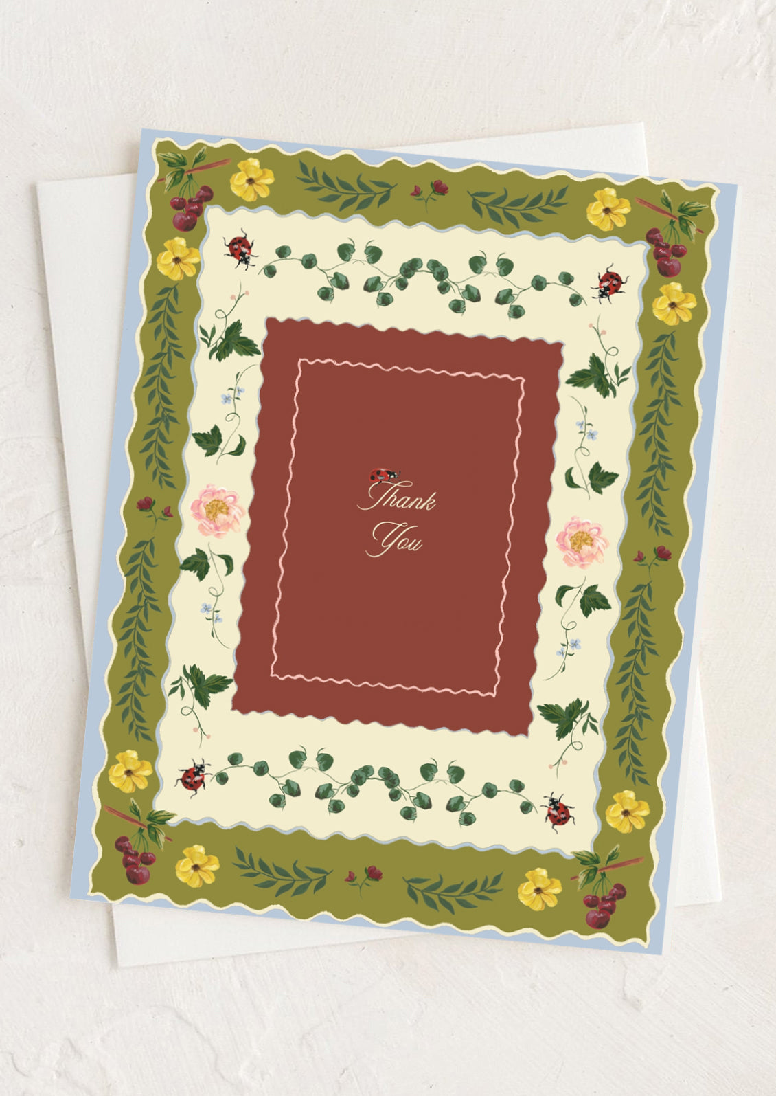 A floral print thank you card.