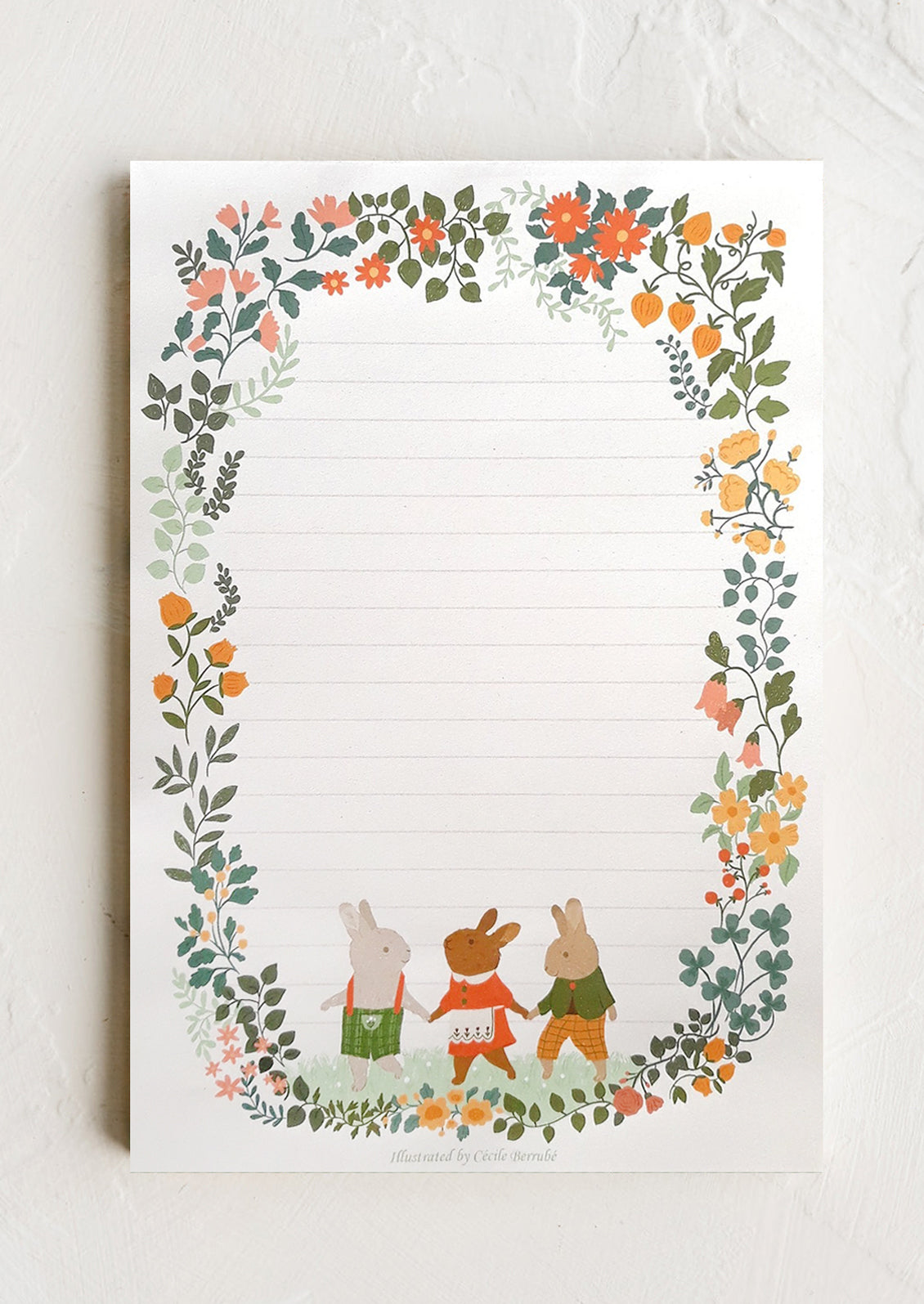 Notepad with floral border and animal characters on a white background