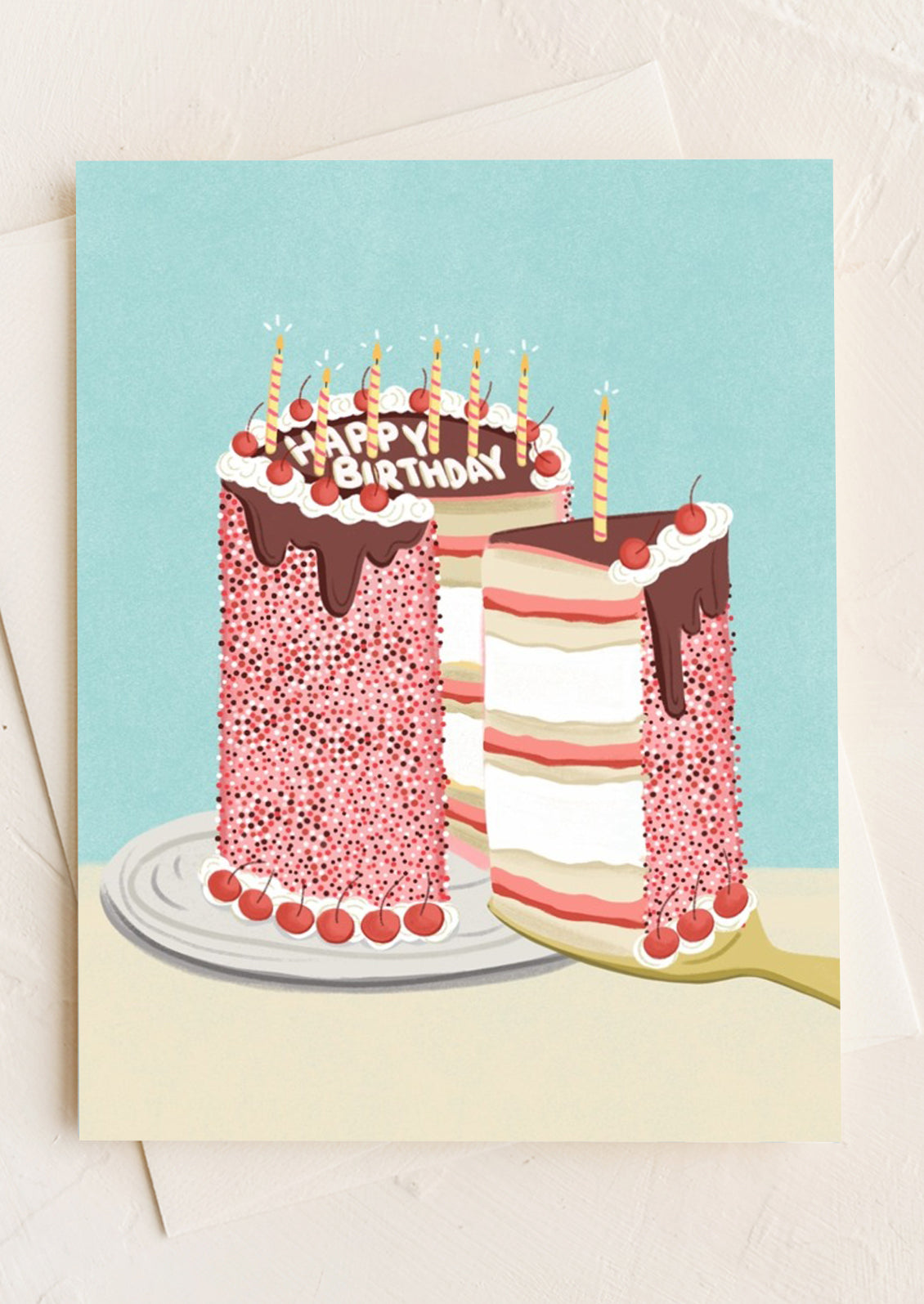 Birthday card with a cake illustration on a light blue background