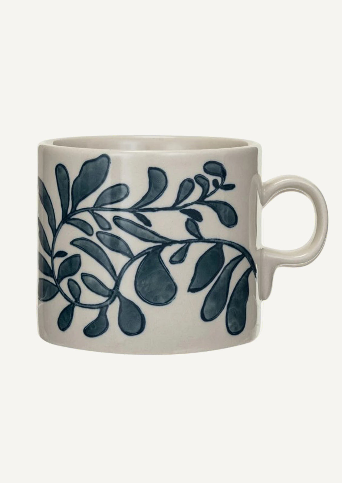 A white ceramic mug with navy blue seaweed pattern.