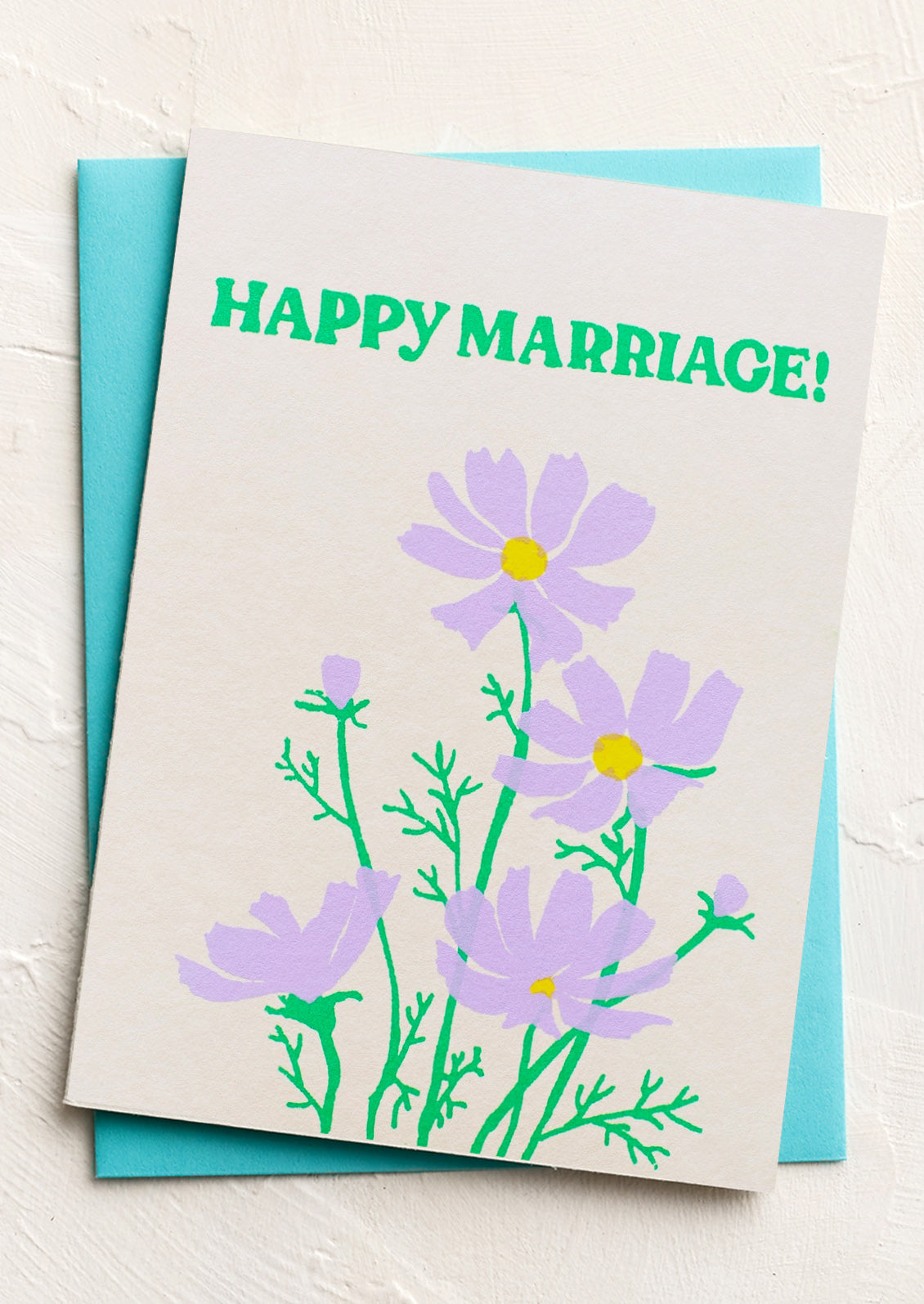 A greeting card with image of purple cosmos, text at top reads "Happy Marriage!".