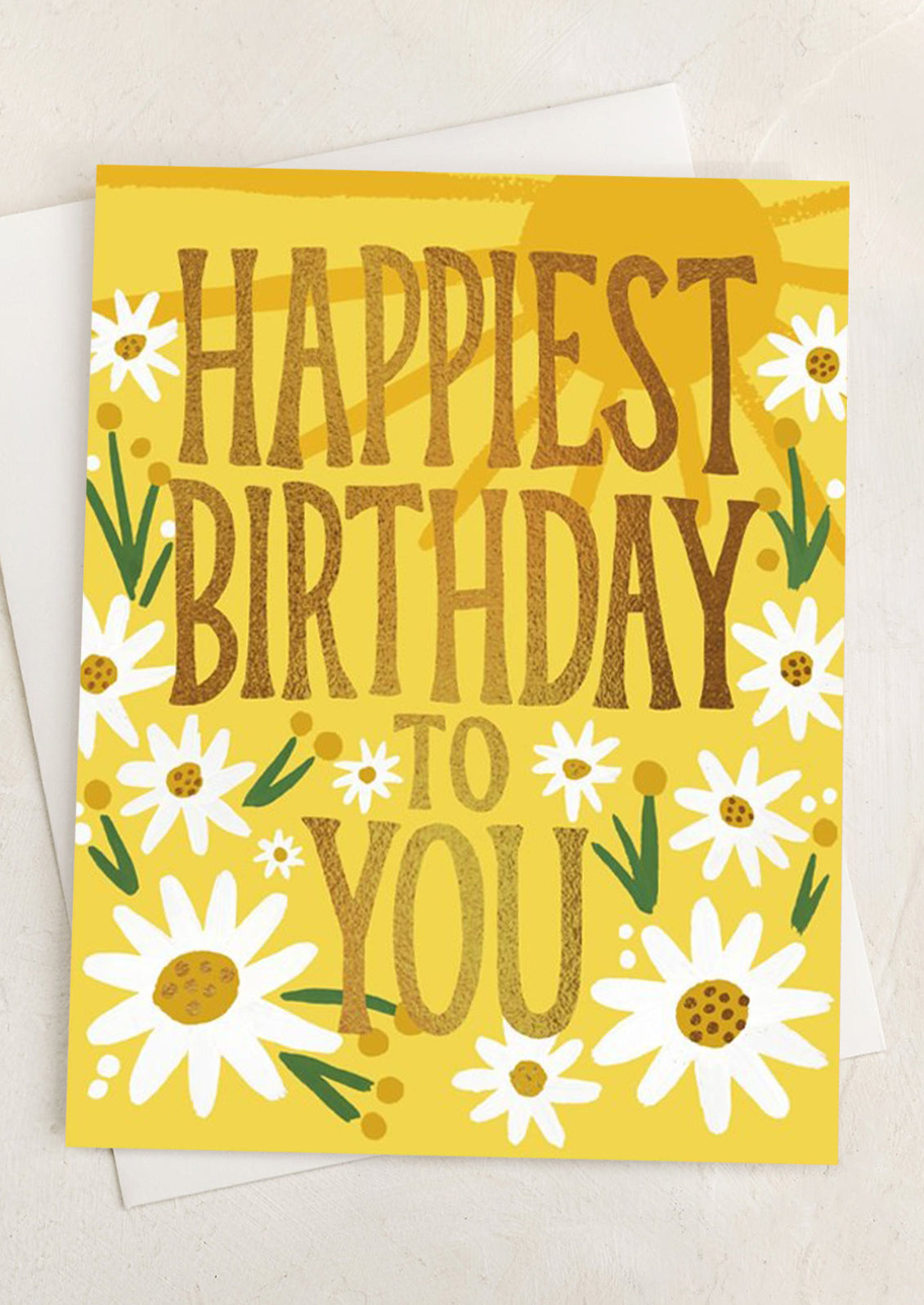 A daisy print yellow card with text reading "Happiest Birthday To You".