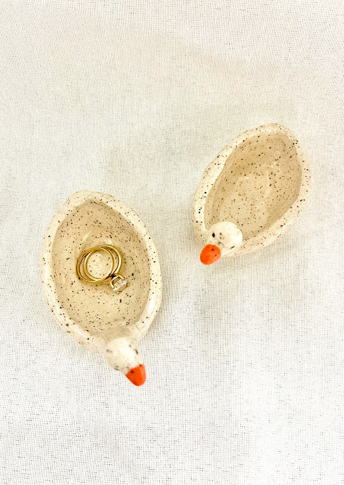 A small bowl dish in the shape of a goose.