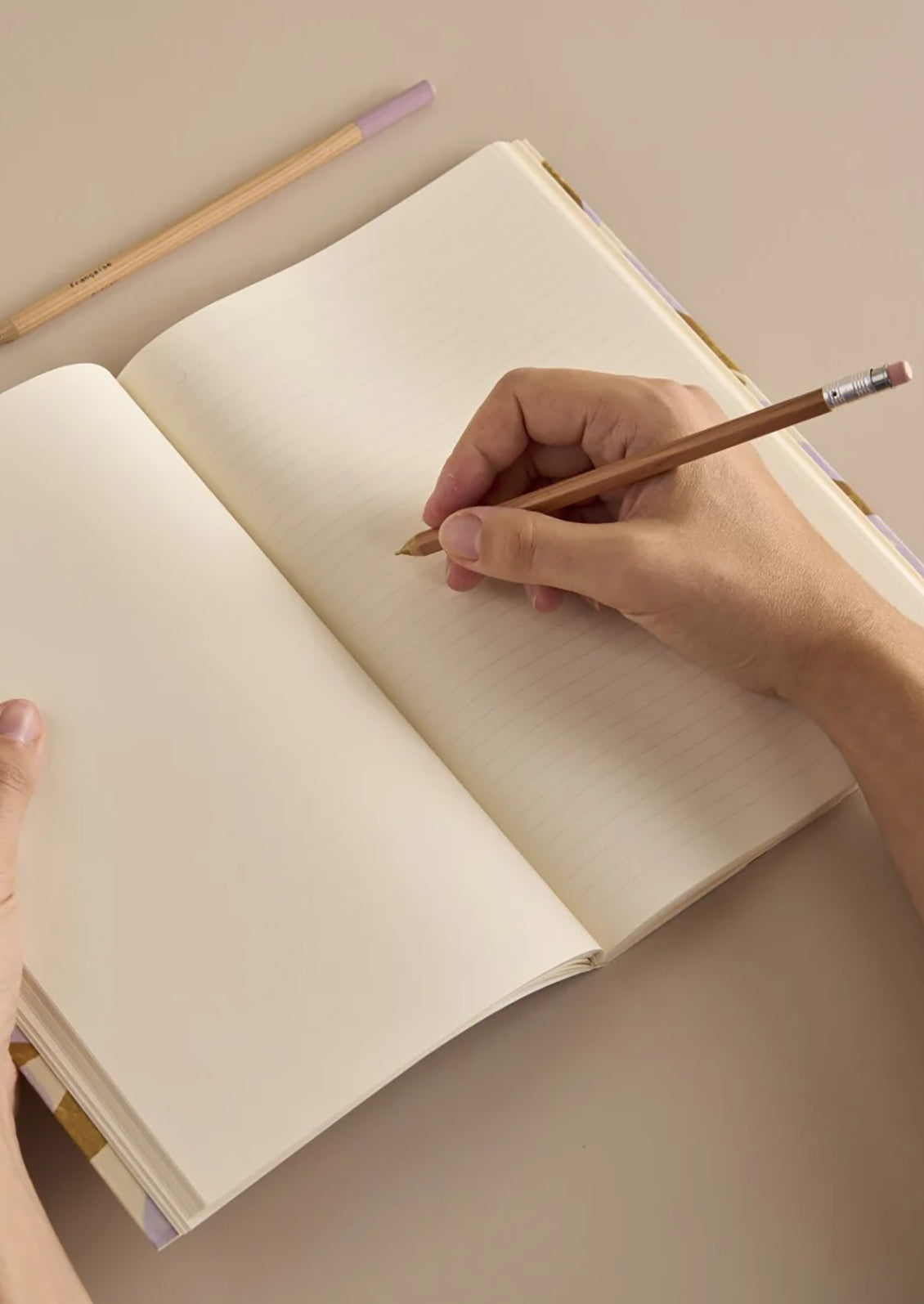 A notebook with colorful plaid print cover.