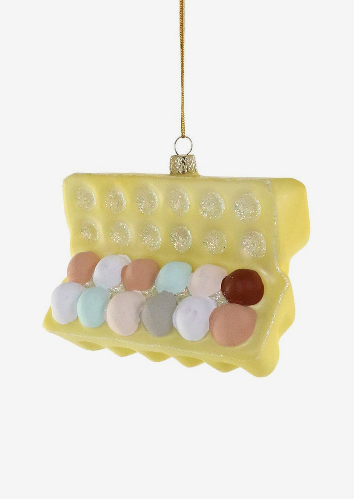 A glass ornament of yellow carton of a dozen multicolored eggs.