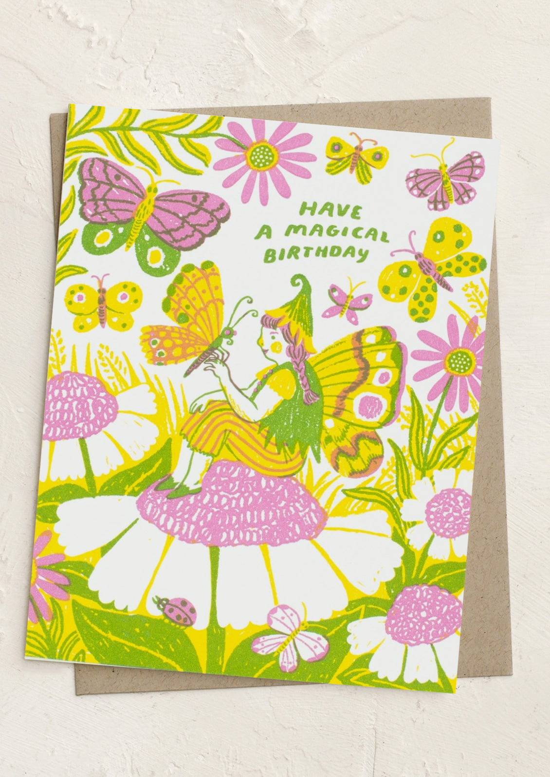 A greeting card with image of fairy and butterfly, text reads "Have a magical birthday".