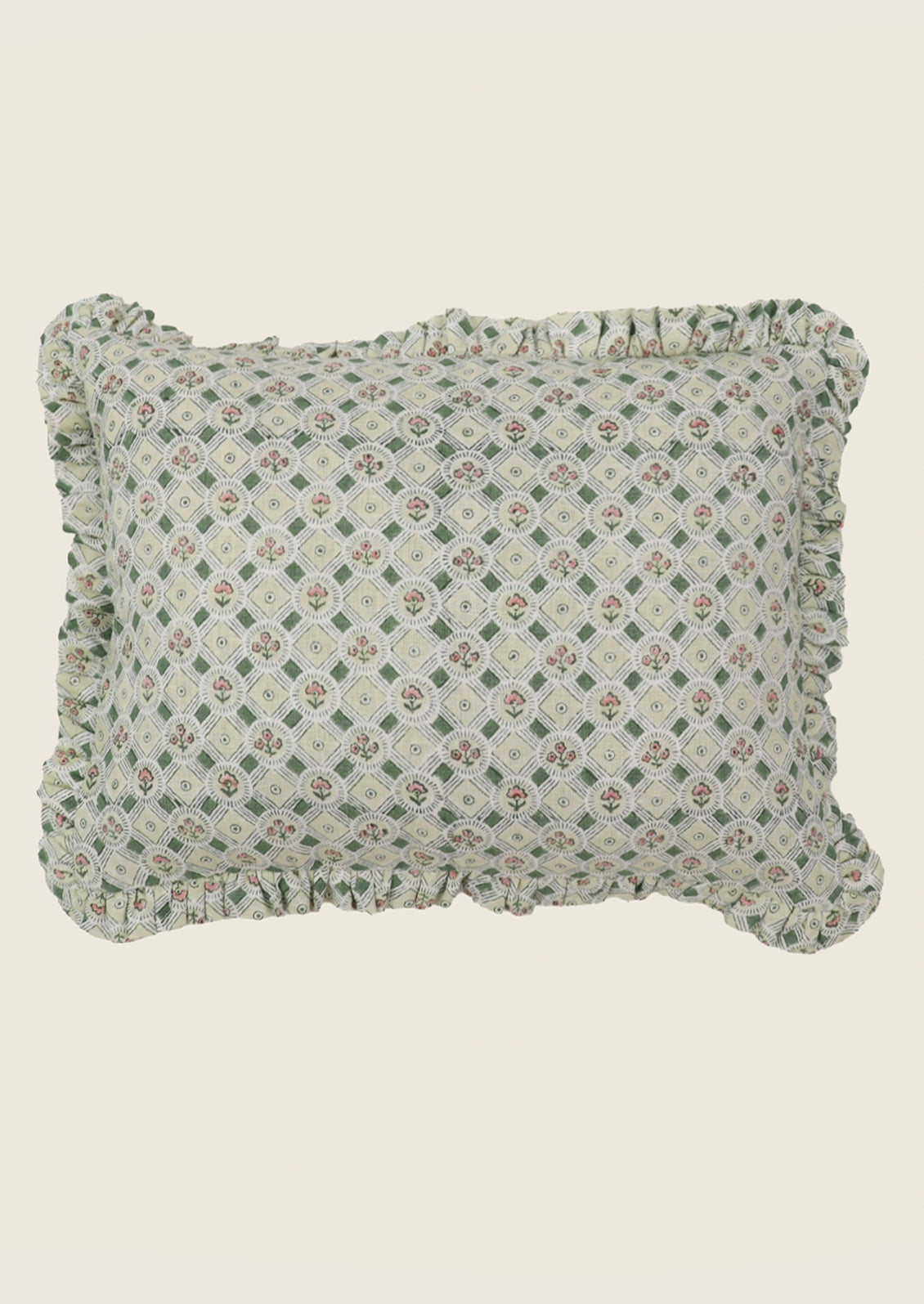 Decorative pillow with green and pink floral pattern.