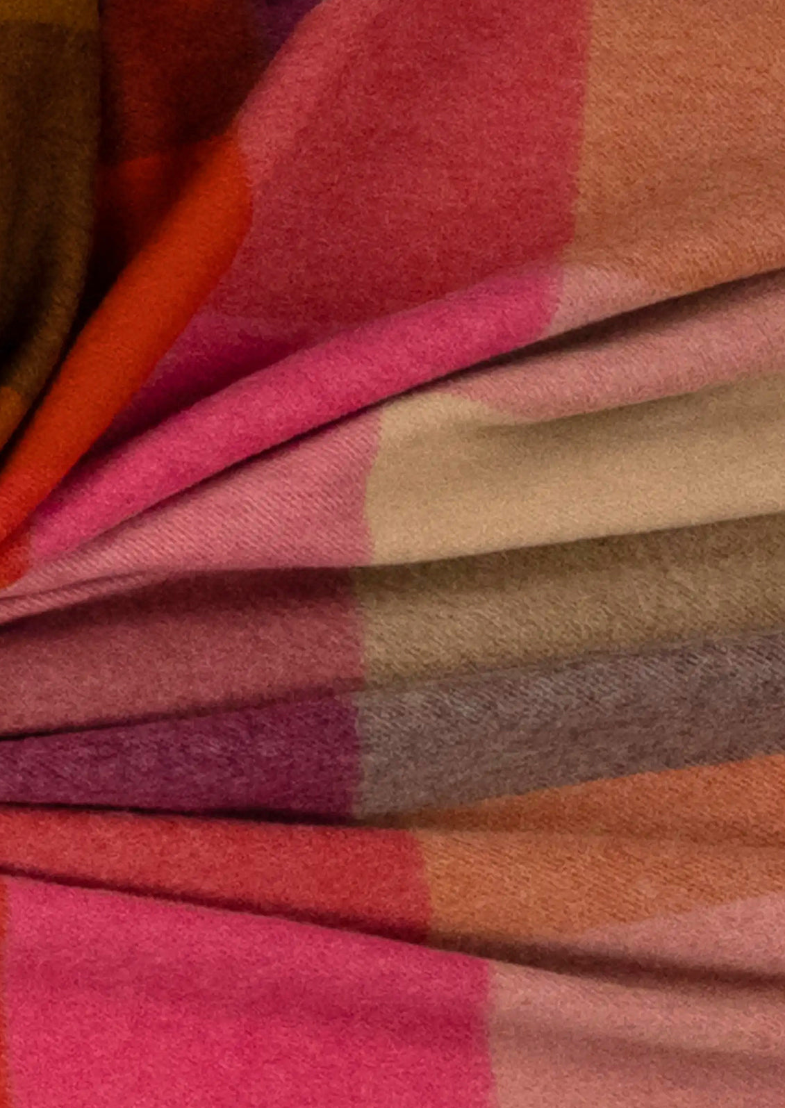Colorful plaid blanket in burgundy multi.