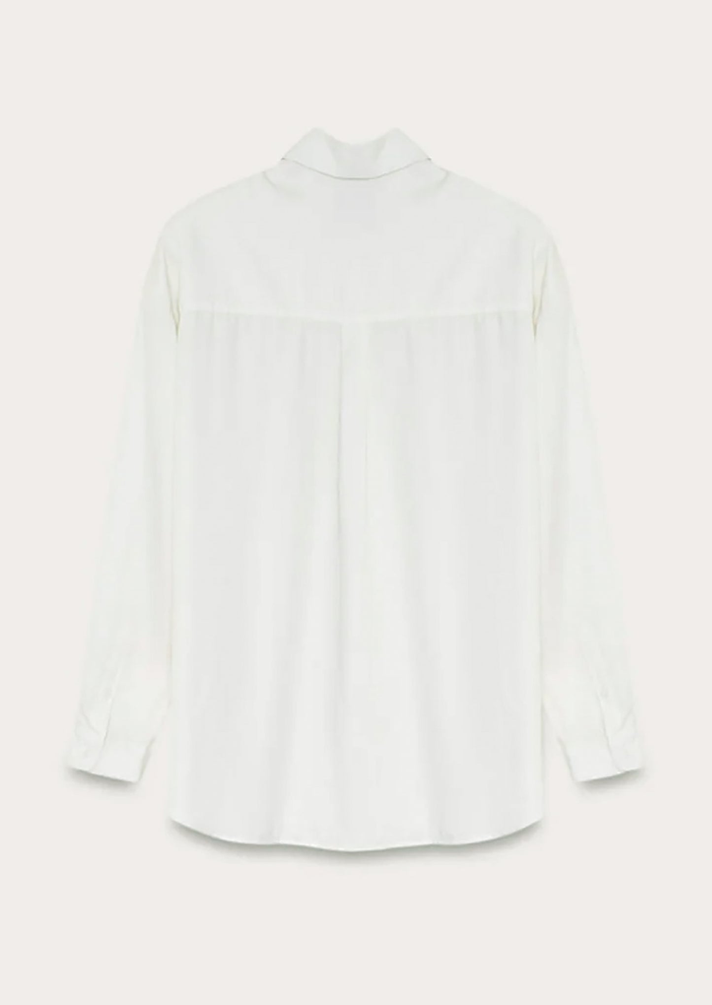 A white button front shirt with gathered back yoke.