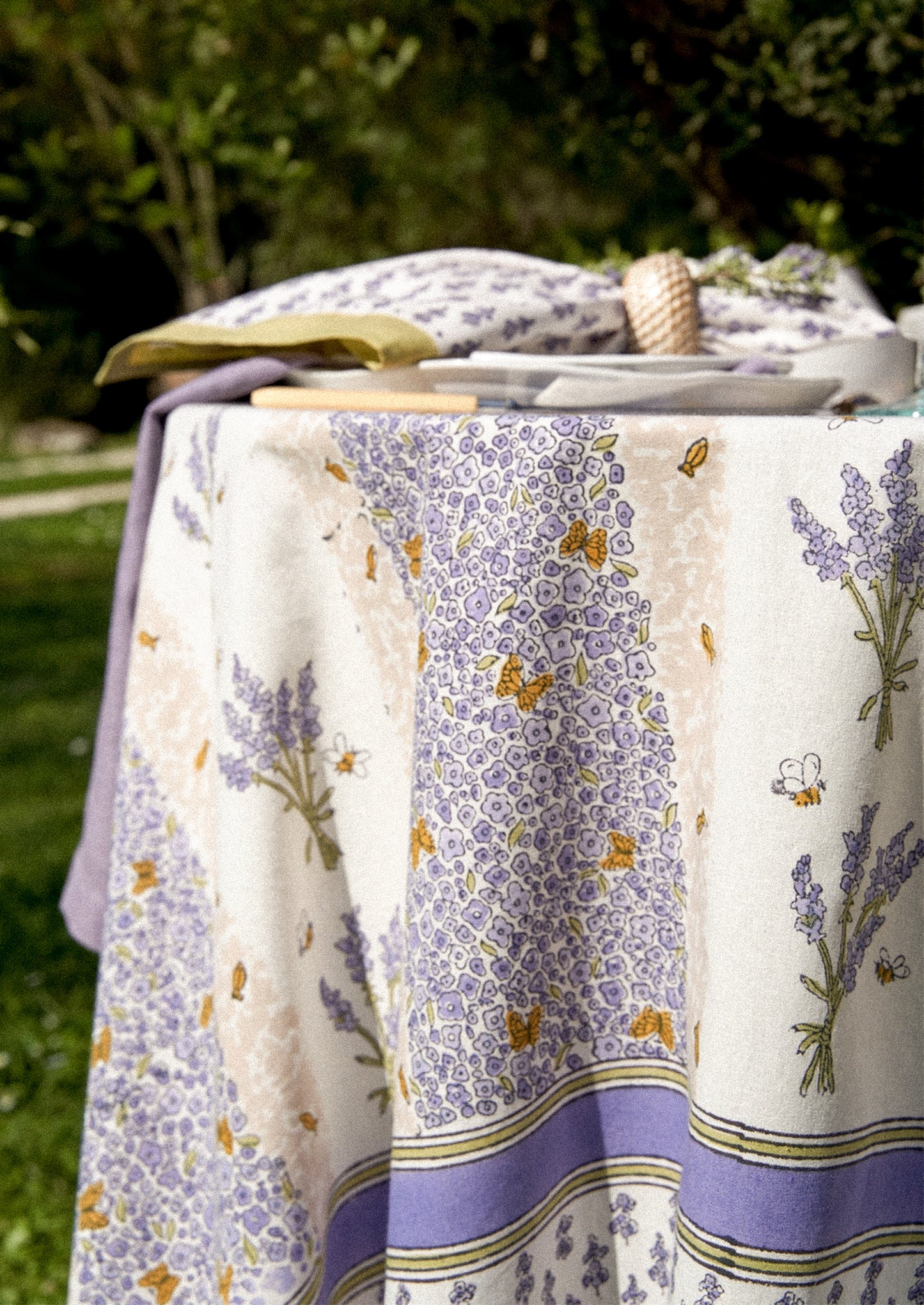 A tablecloth with lavender and bee print.