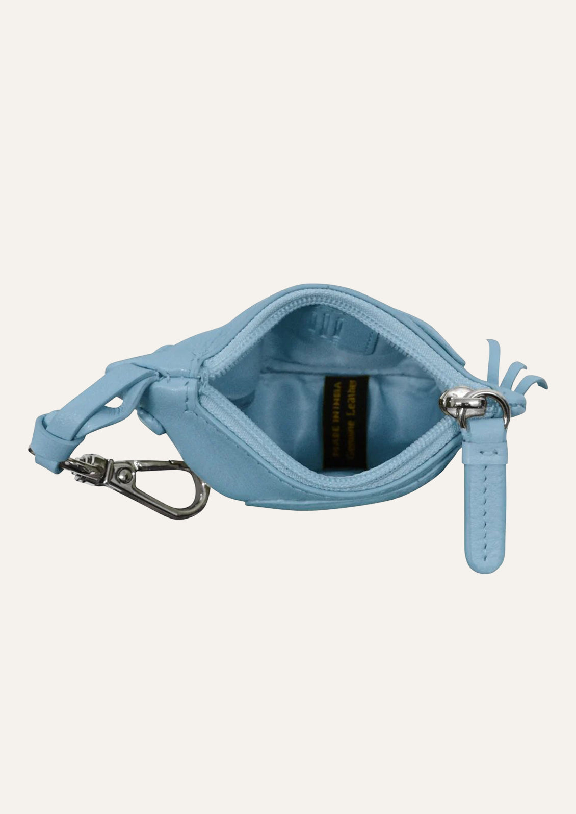 Top view of a small sky blue leather pouch with the zipper open showing the inside.