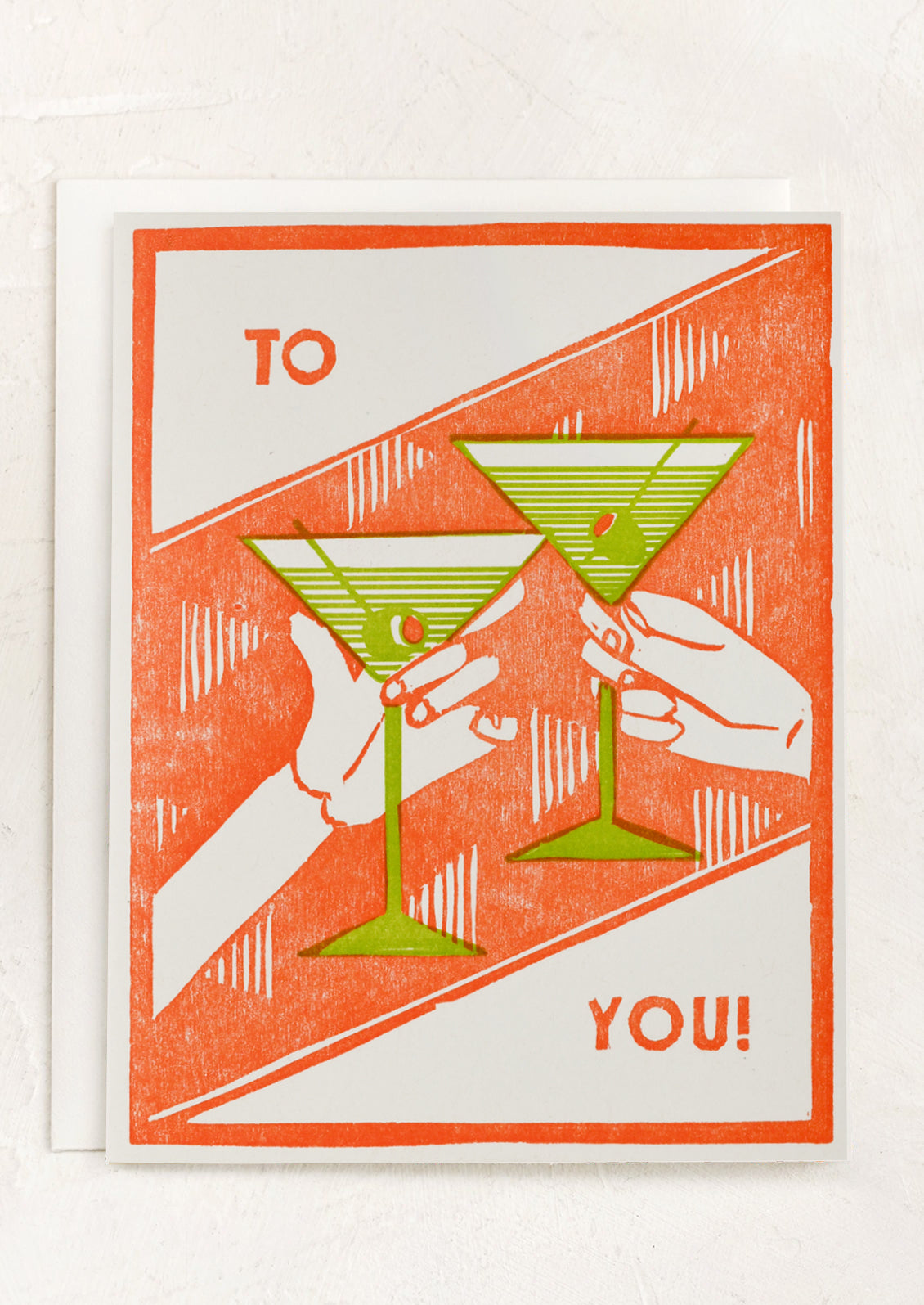 A greeting card with image of two clinking martini glasses, text reads "To you!".
