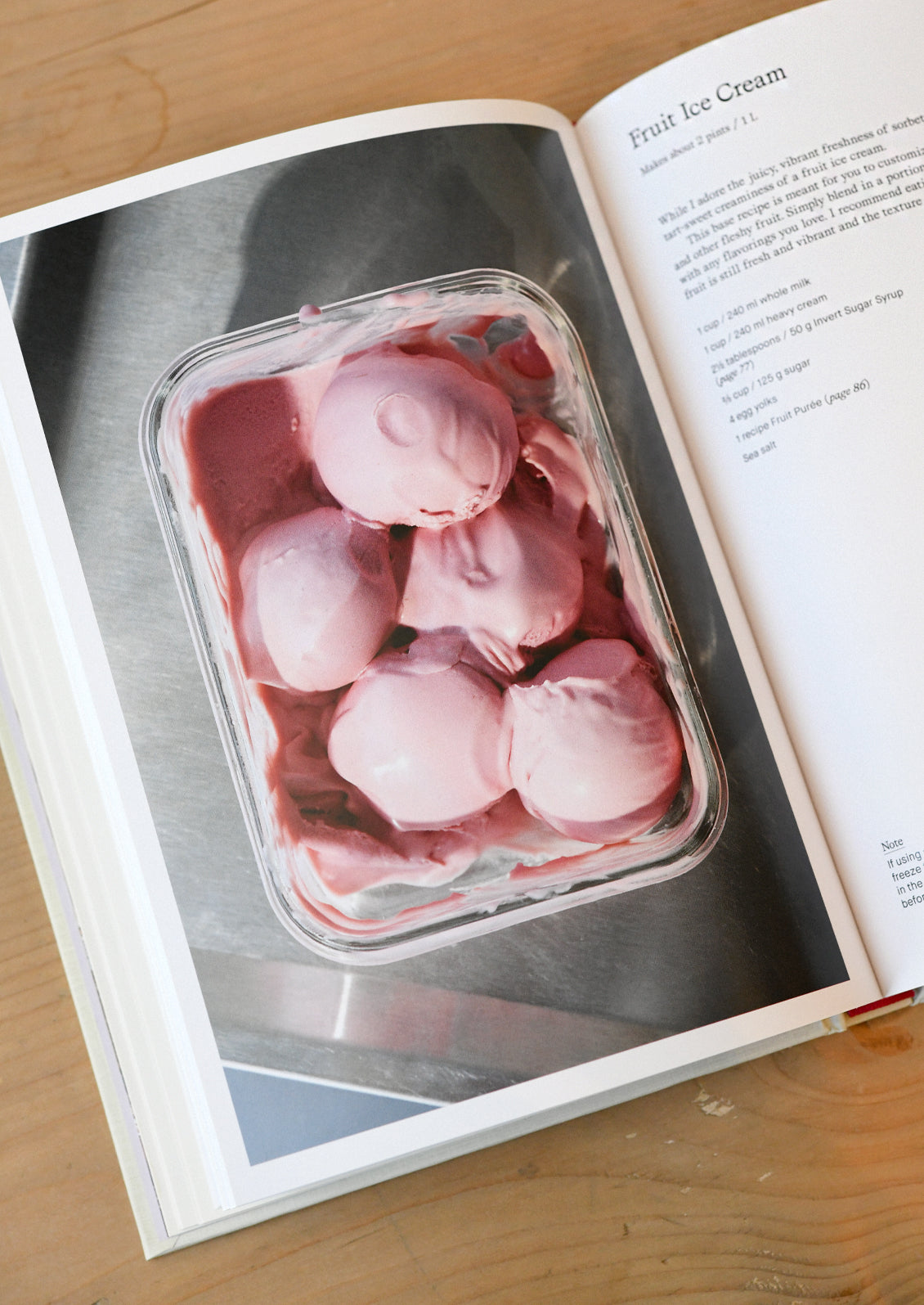 An open cookbook showing fruit ice cream.