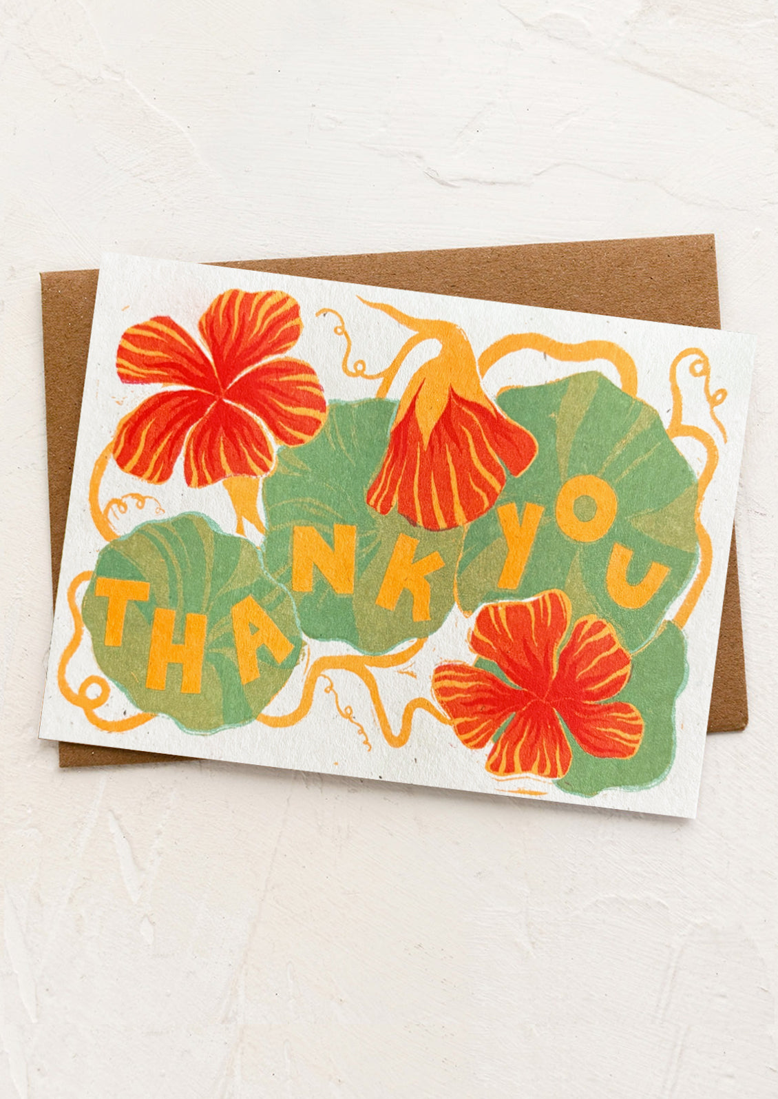 A nasturtium print greeting card with "Thank you" text.