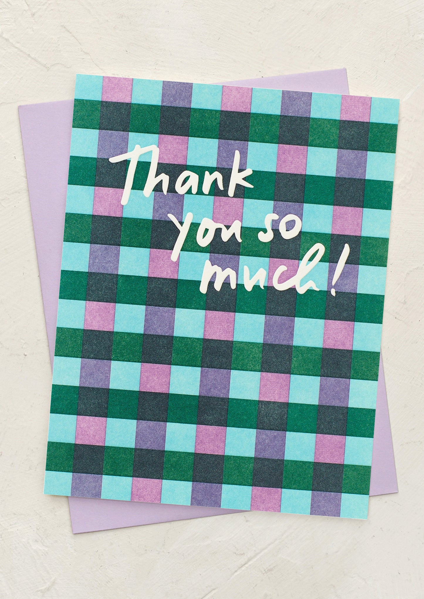 A plaid patterned greeting card reading "Thank you so much!".