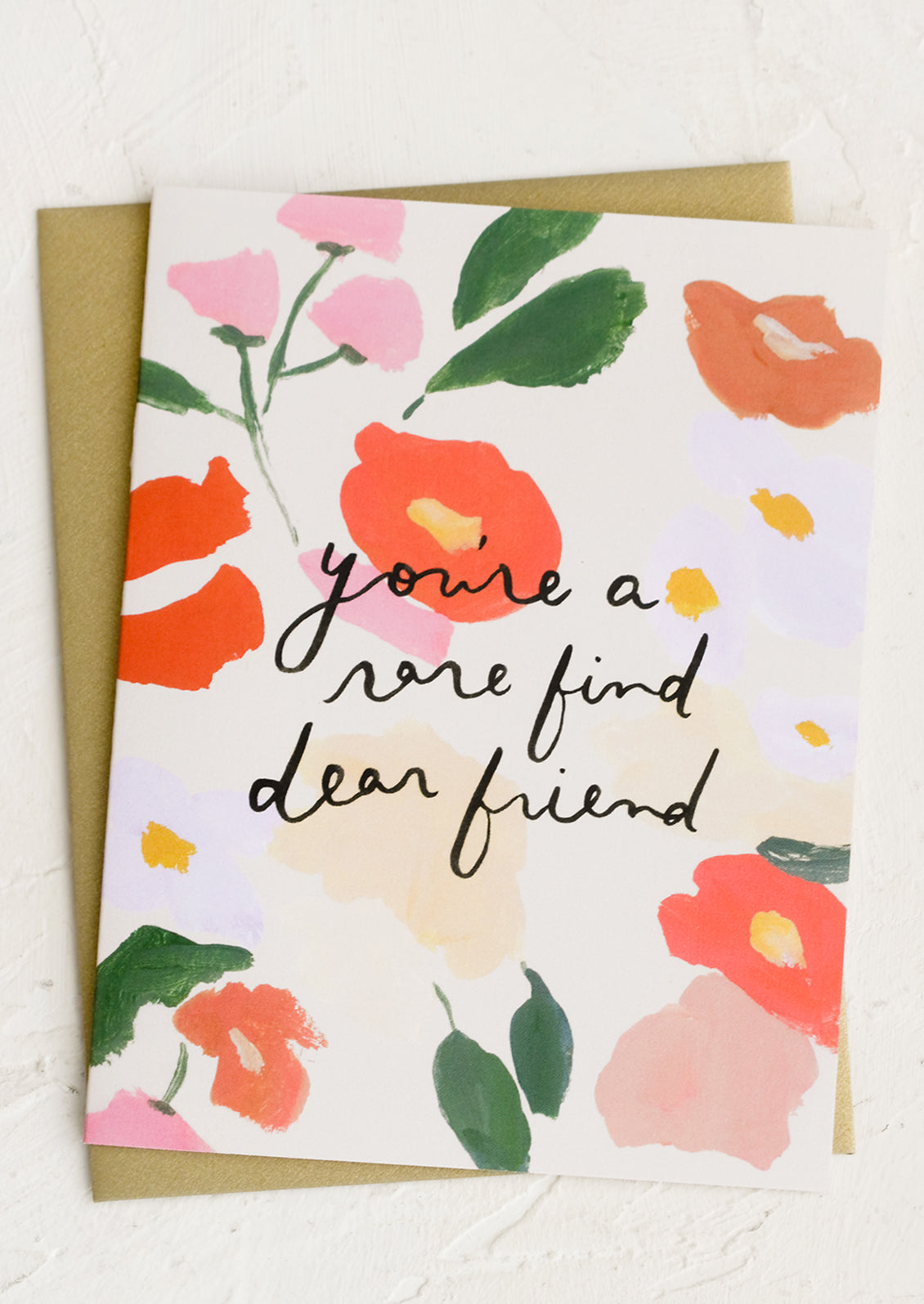 A floral print card reading You're A Rare Find, Dear Friend.