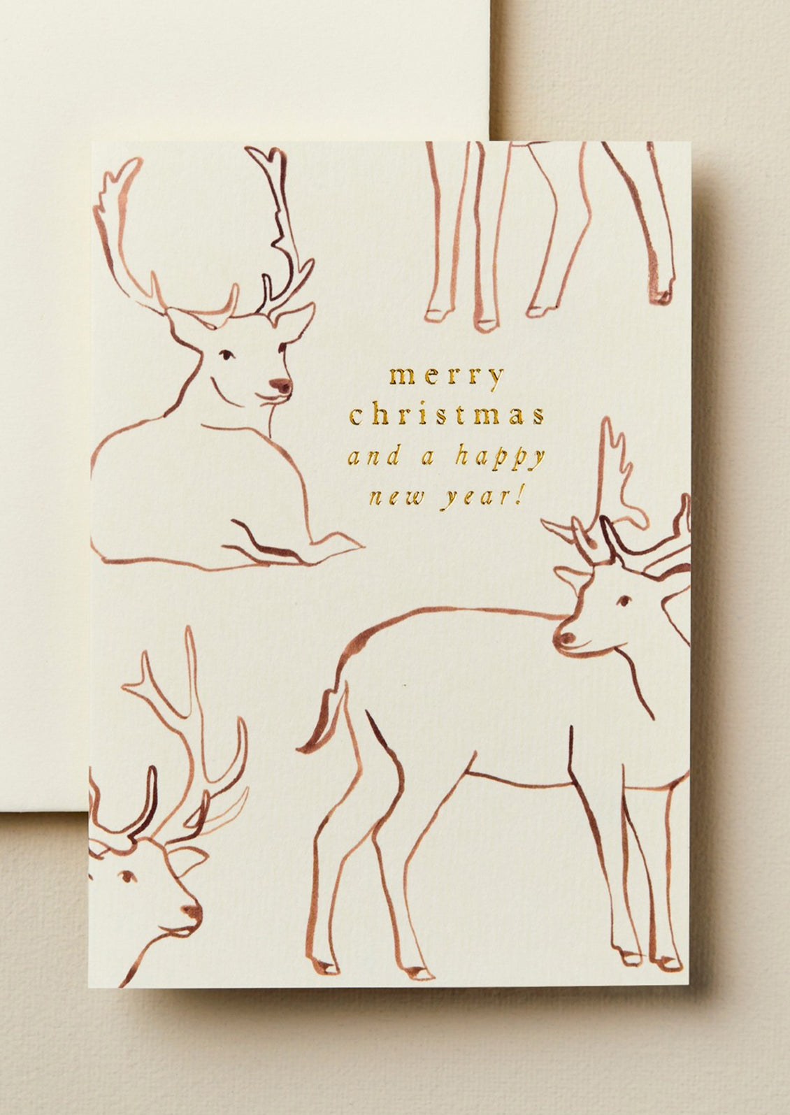 A reindeer print card reading "Merry Christmas and a happy new year!".