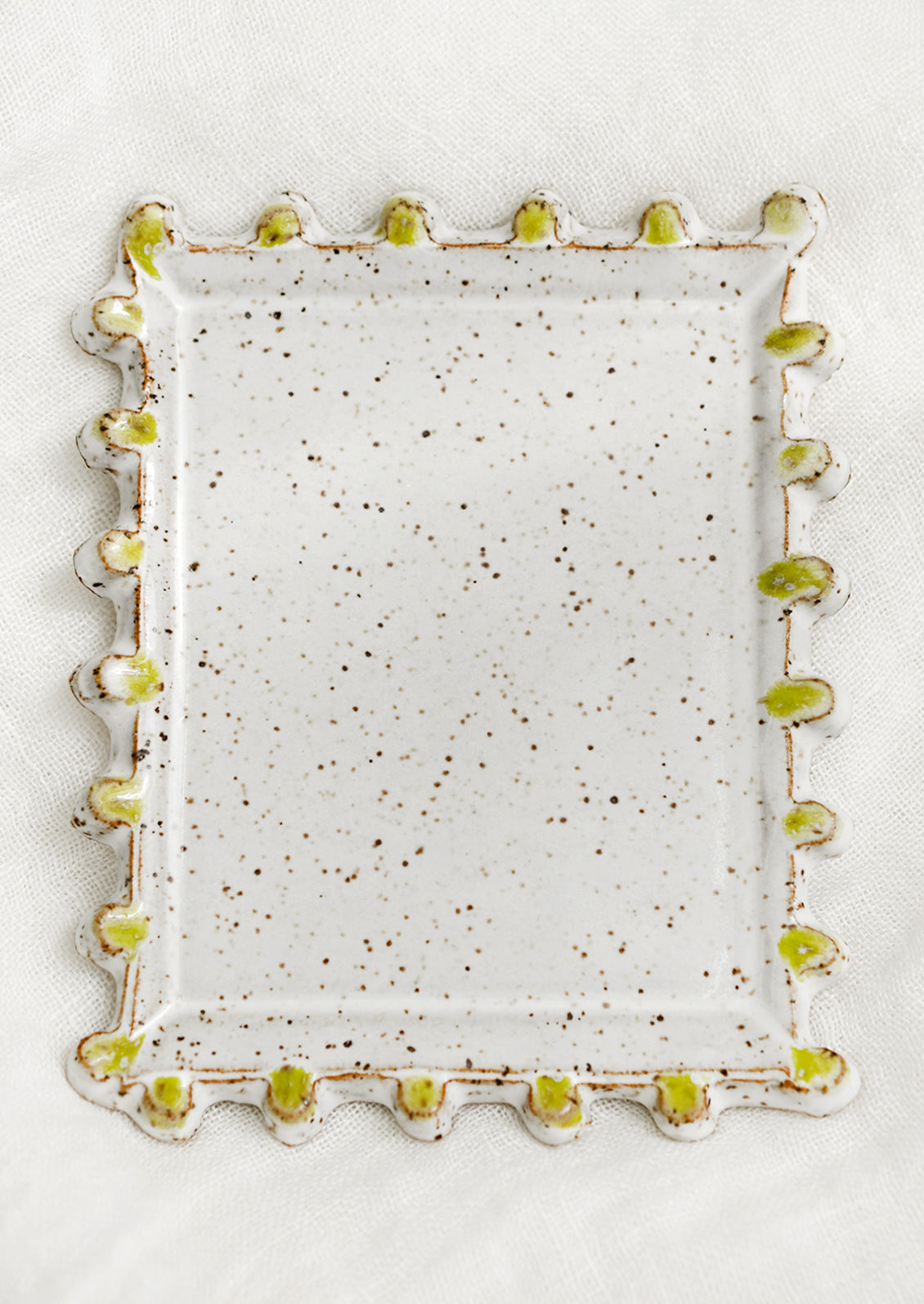 A rectangular ceramic dish with decorative trim.