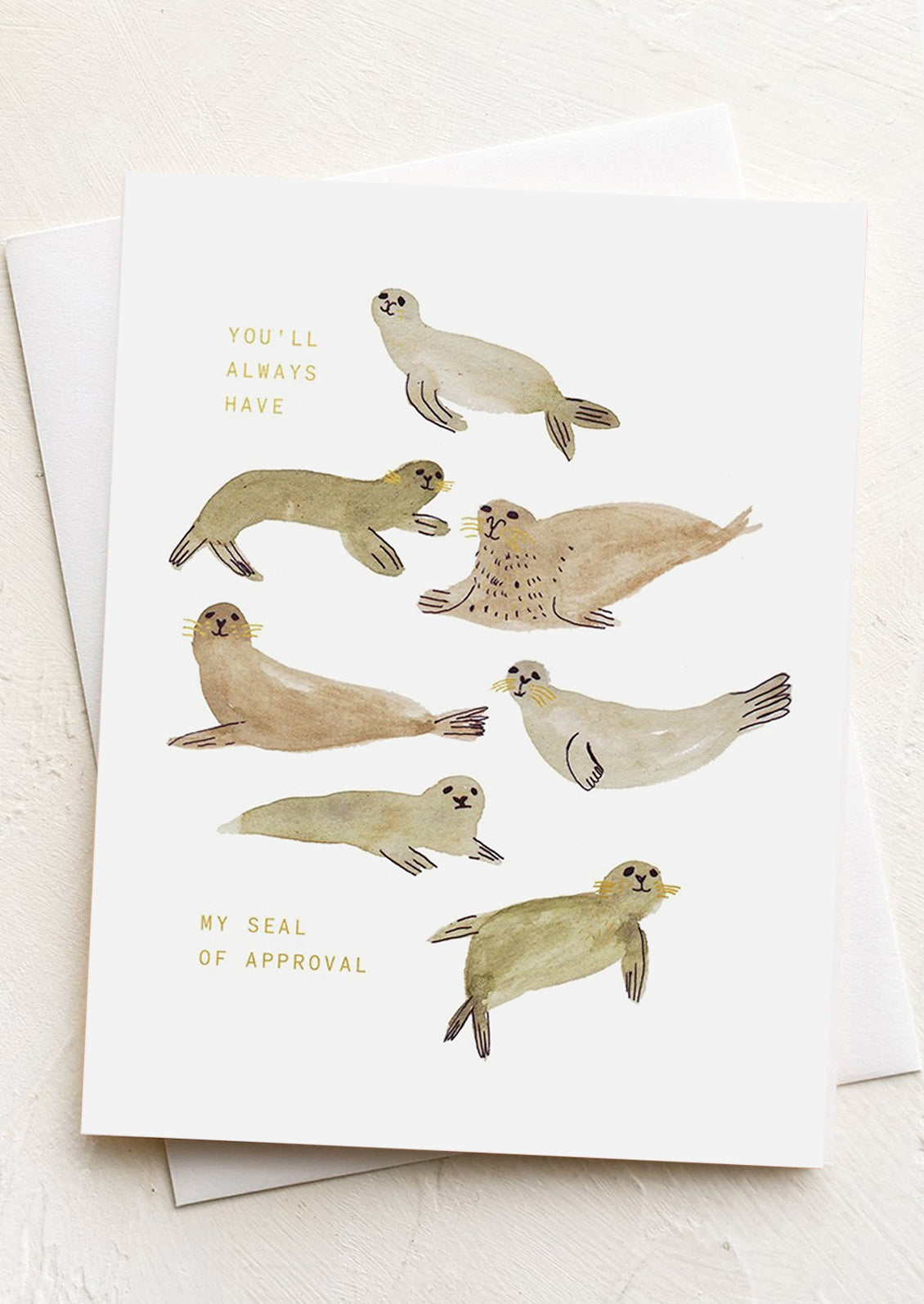 A greeting card with illustration of seals, text reads "You'll Always Have My Seal Of Approval".