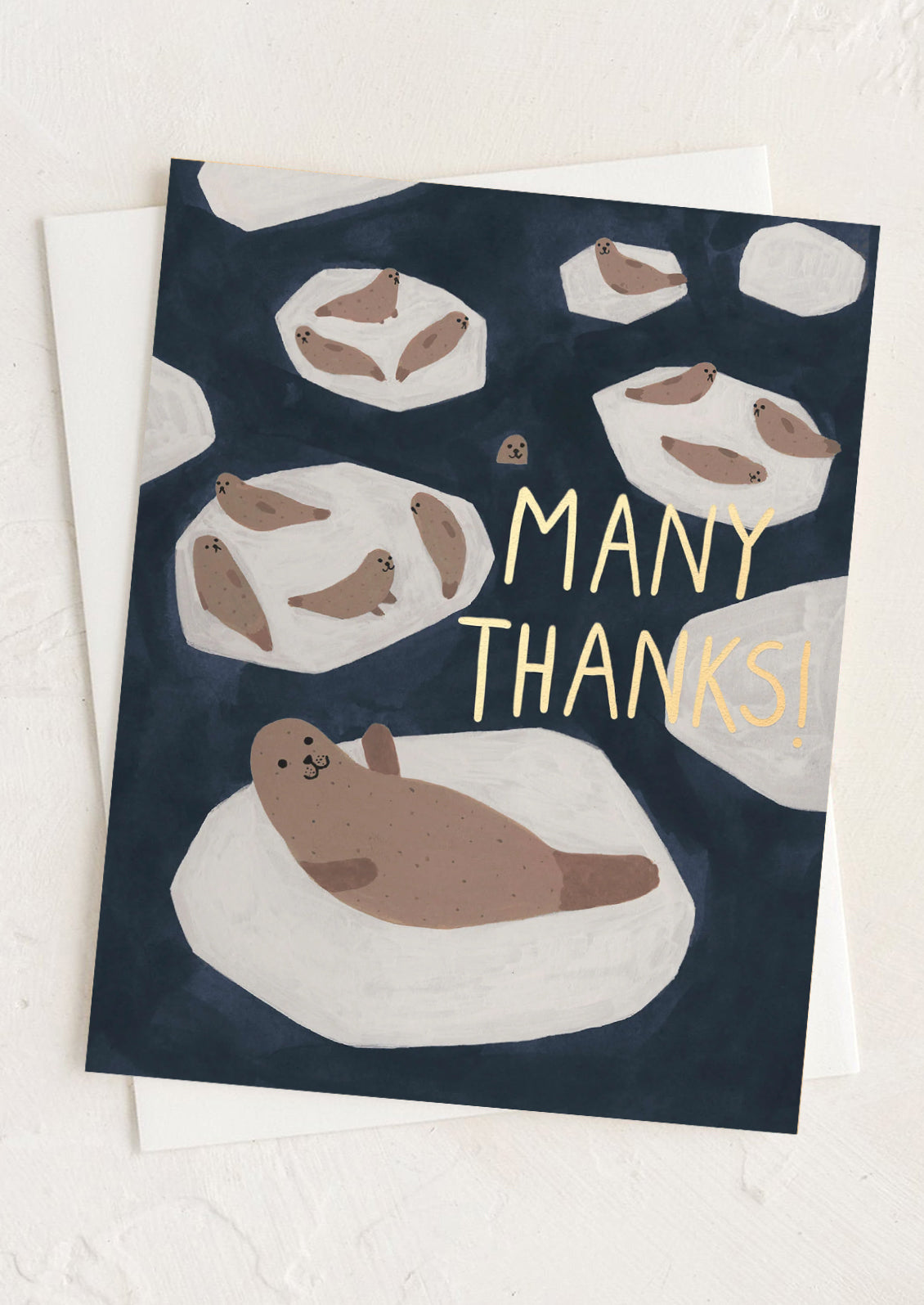 A greeting card with illustration of seals, gold text reads "Many thanks!".