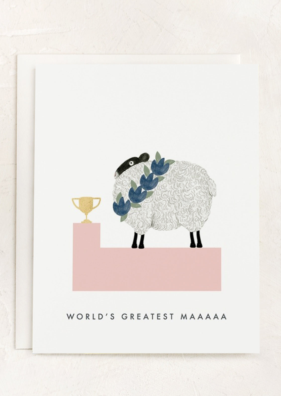A greeting card with illustration of sheep winning a trophy, text reads "World's Greatest Maaaaaa".