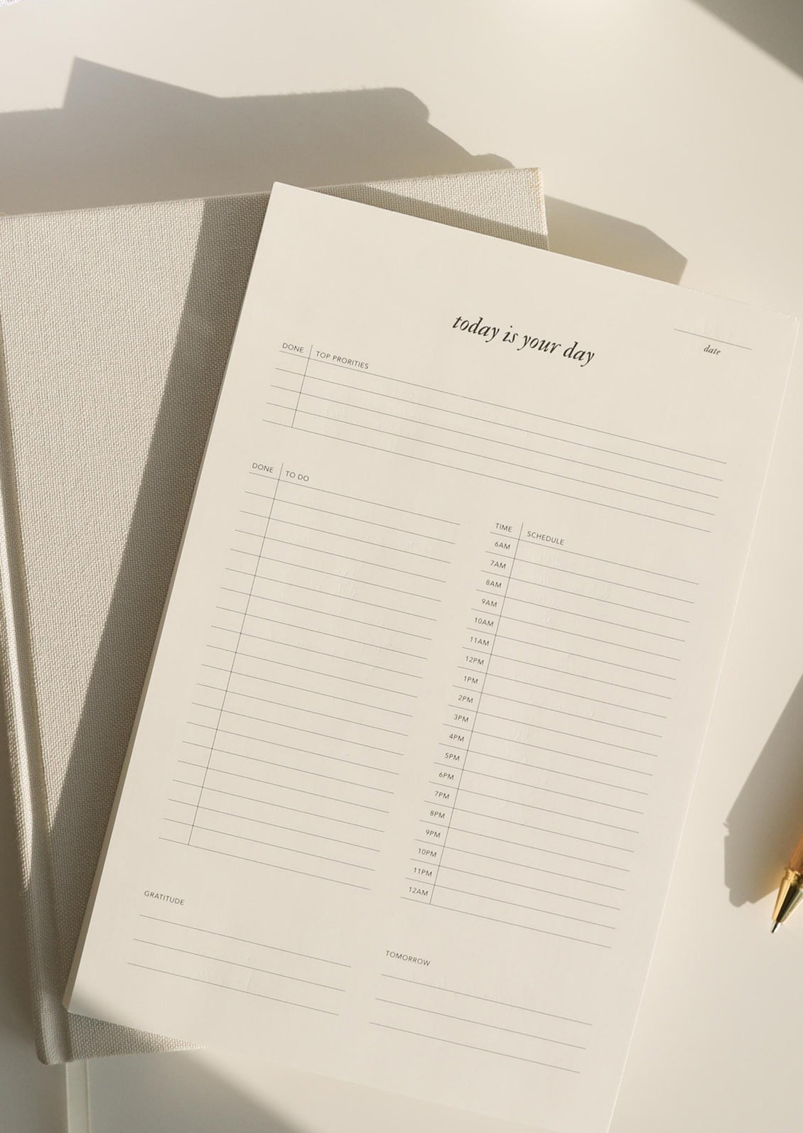 A to do list notepad reading "Today is your day".