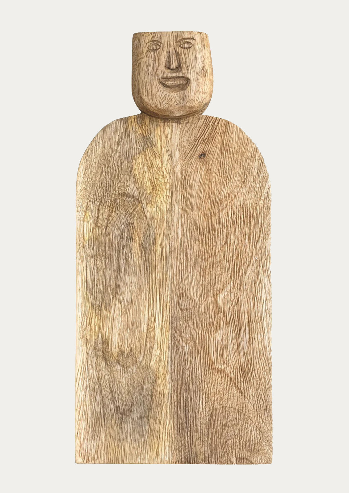 A wooden serving board with a face carved into the handle.