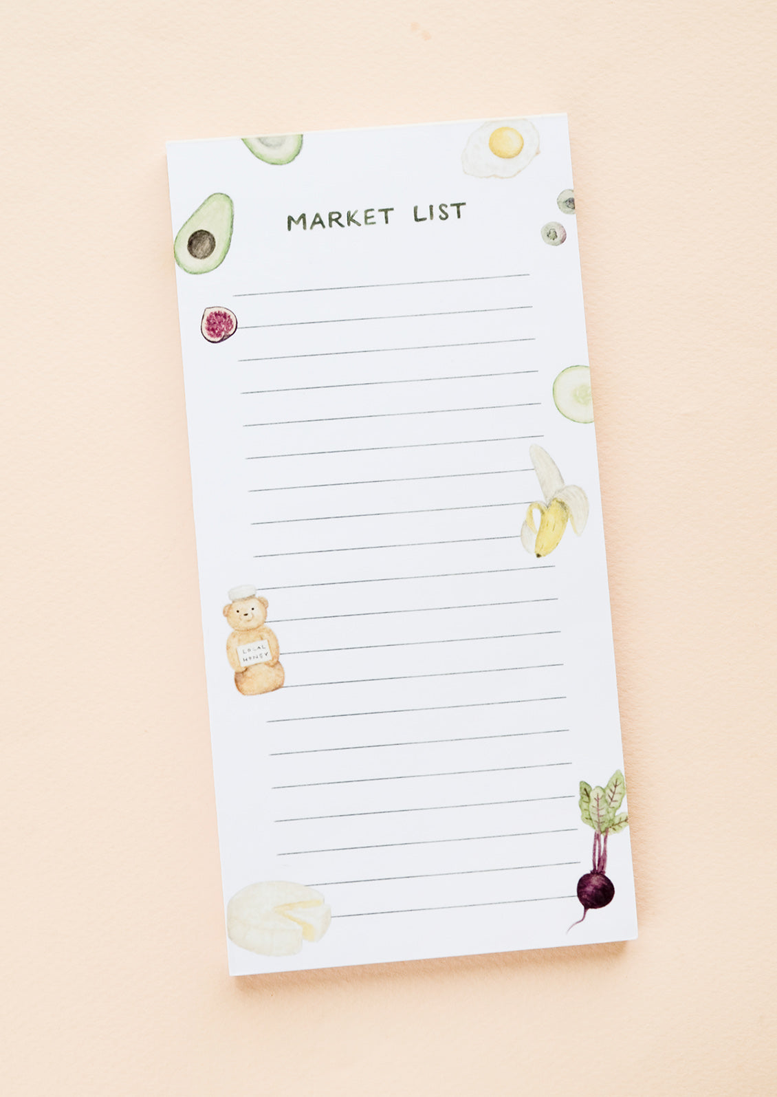 A printed notepad for making grocery lists, illustrated at sides with various food items.