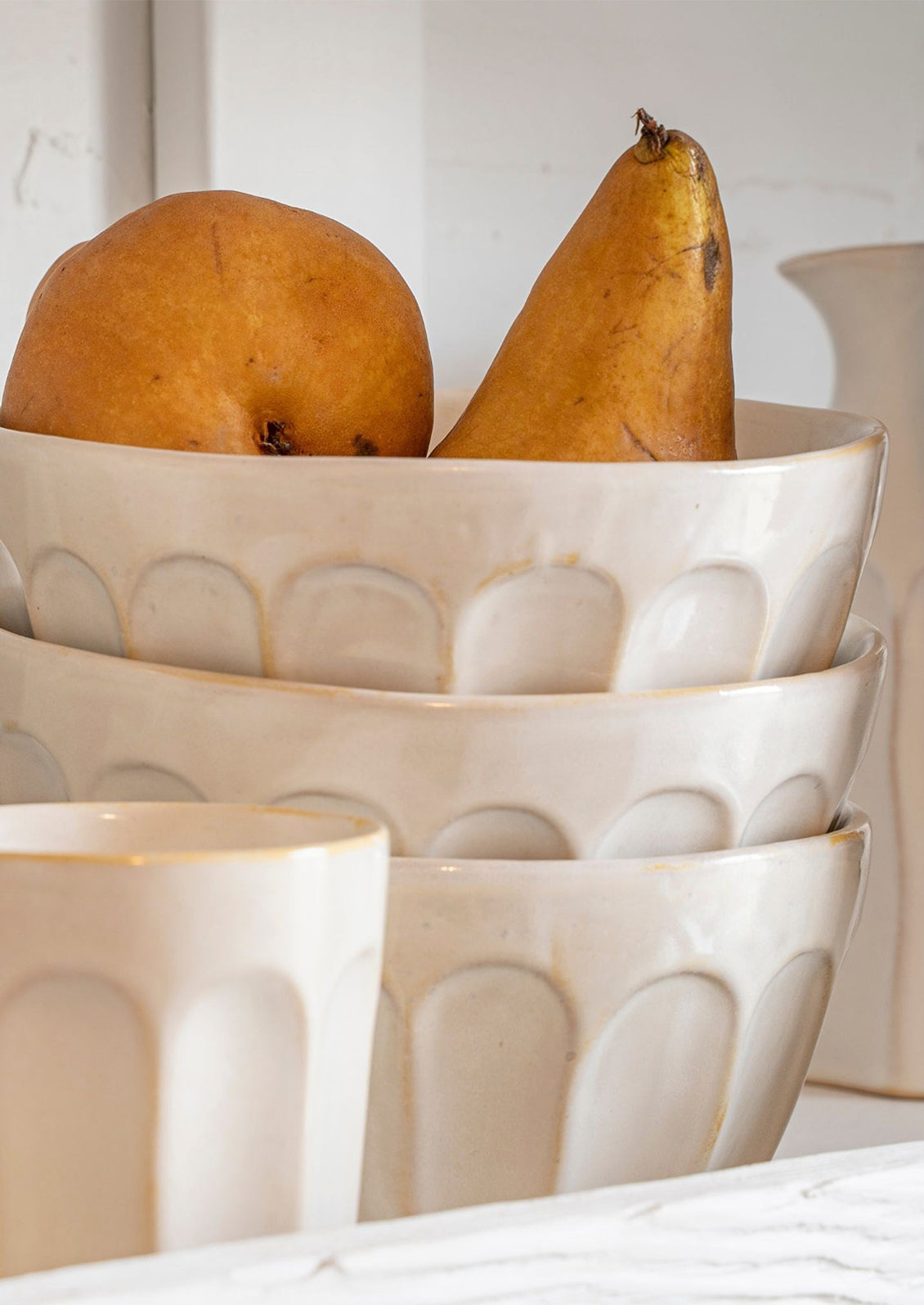 A white bowl with classic bistro style texture.