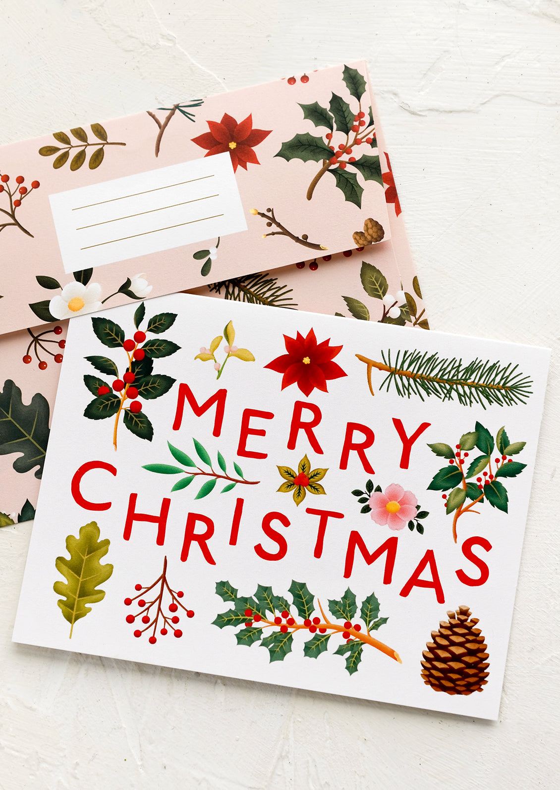 A botanical print christmas card with text reading "Merry Christmas".