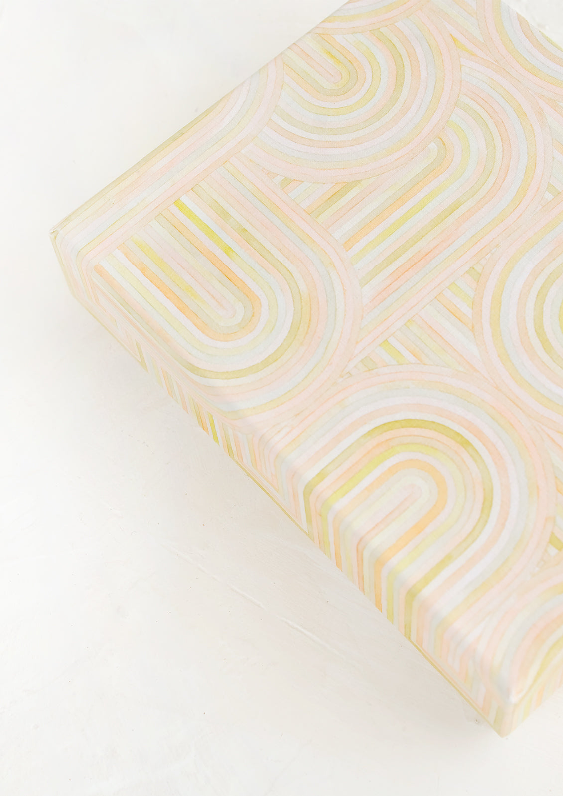 A decorative gift box with pastel line drawing.