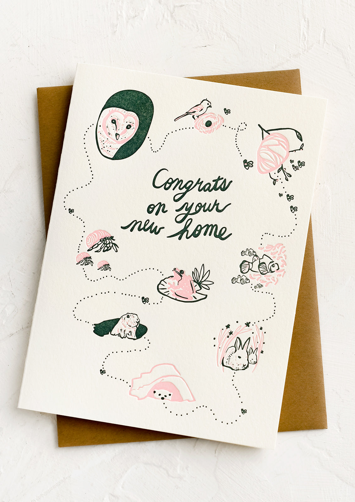 A card with drawings of animals, text reading "Congrats on your new home".