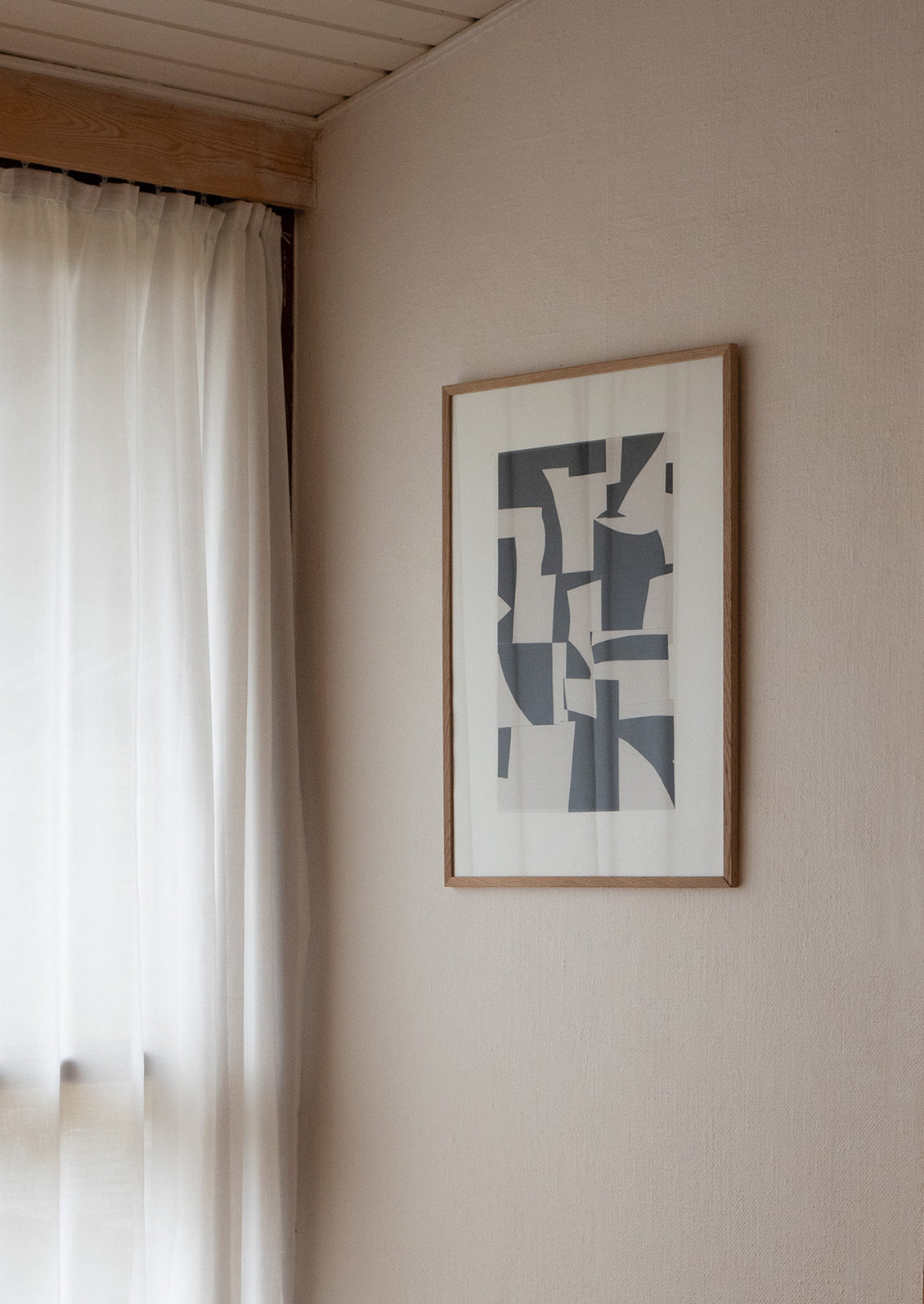 A black and white abstract art print with pieces of paper layered together.