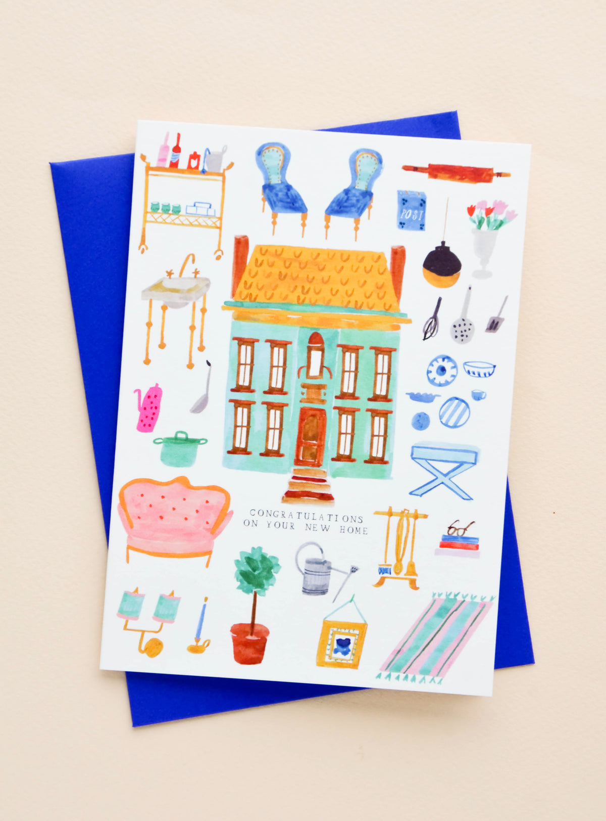Greeting card with illustrated images of household decorations and objects, text reads "Congratulations on your new home"