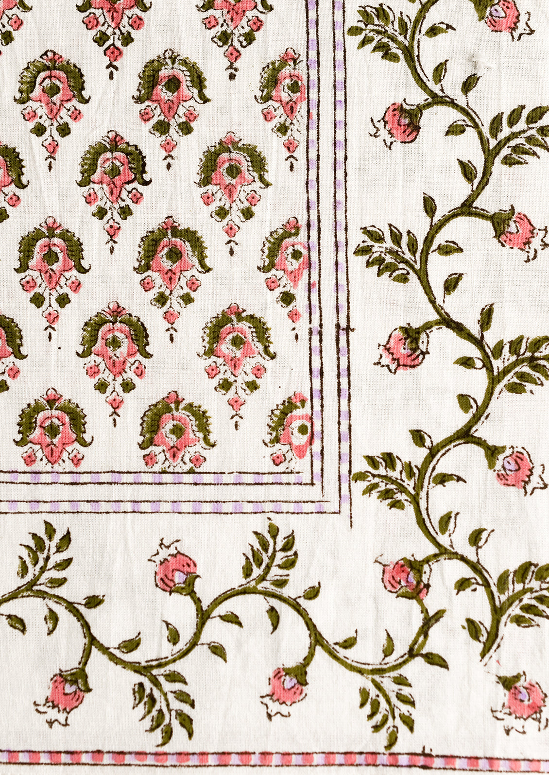 A pair of block print napkins in pink and purple floral.