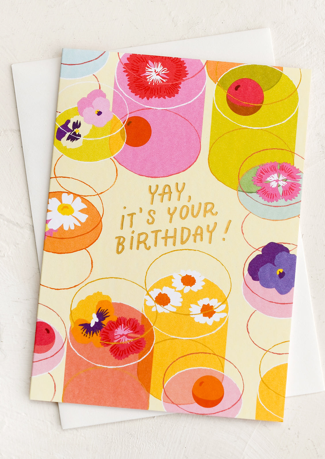 A card with illustration of cocktails with flowers in them, text reads "Yay, it's your birthday!".