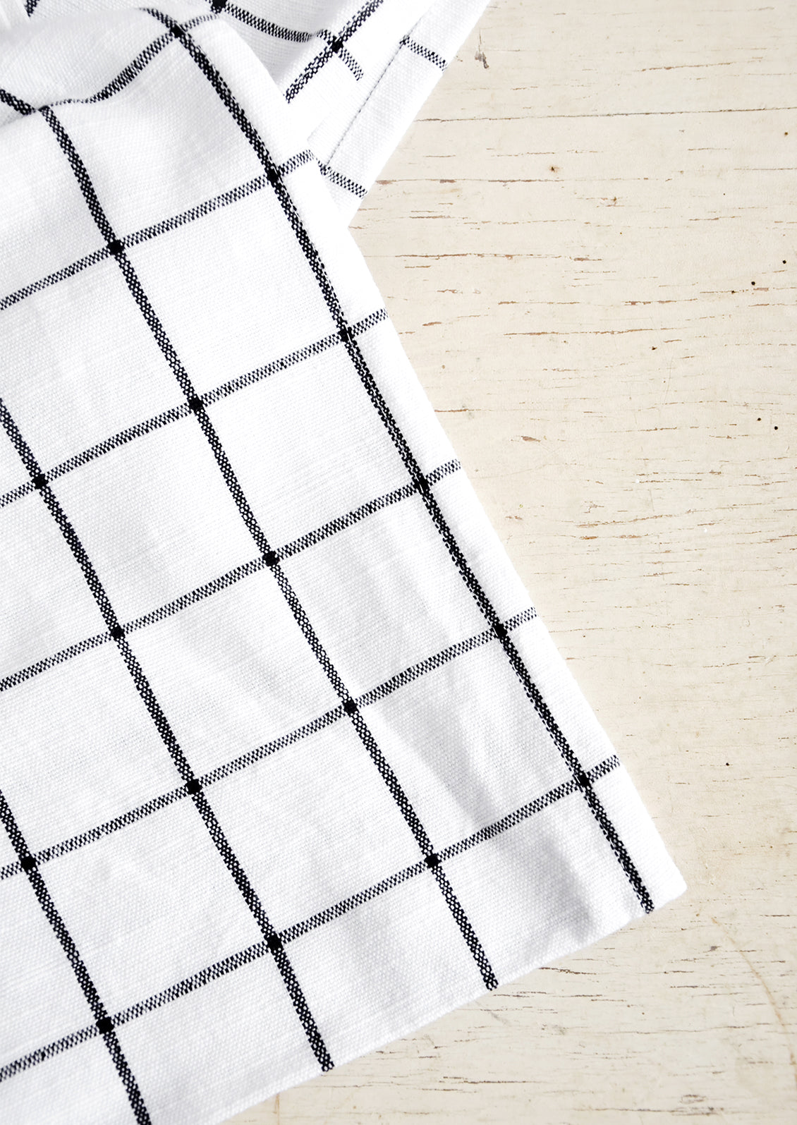 White cotton tablecloth with black grid pattern
