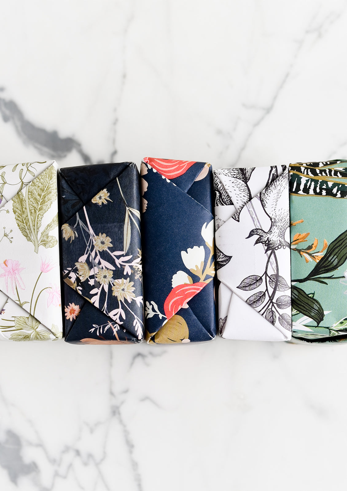 Wrapped bars of soap in assorted prints and scents.
