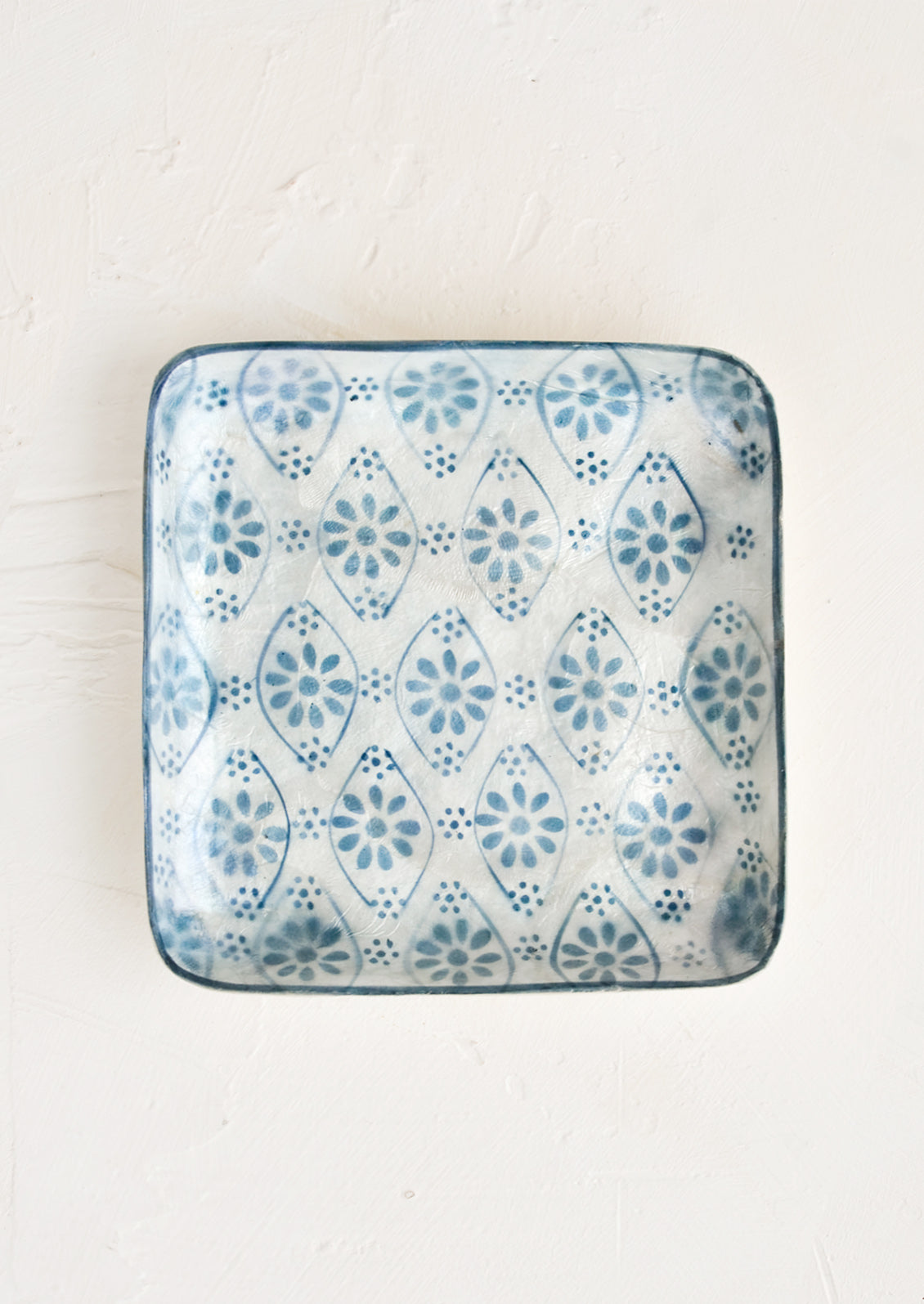 A small square catchall tray in indigo motif.