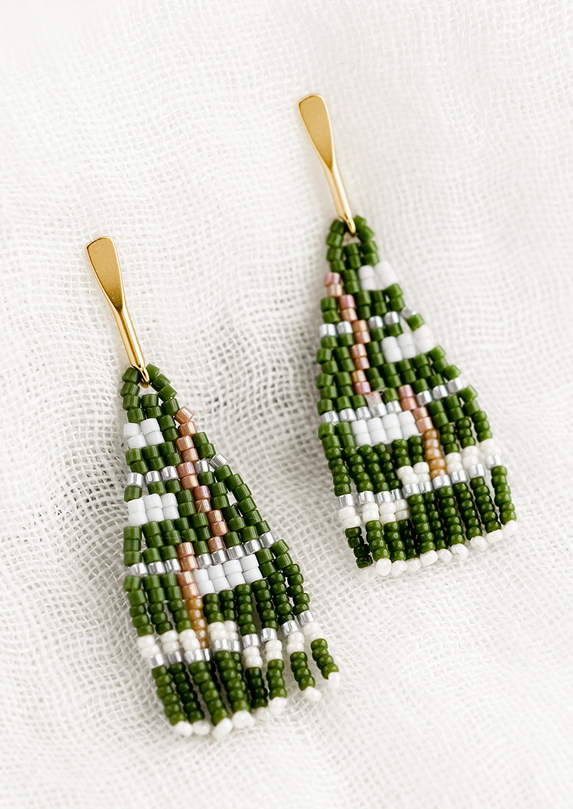 A pair of beaded earrings in green colorway.
