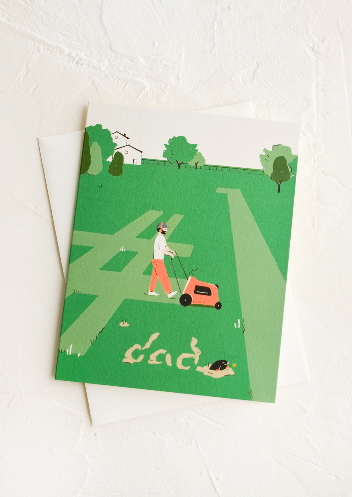 A greeting card picturing a man mowing the grass.