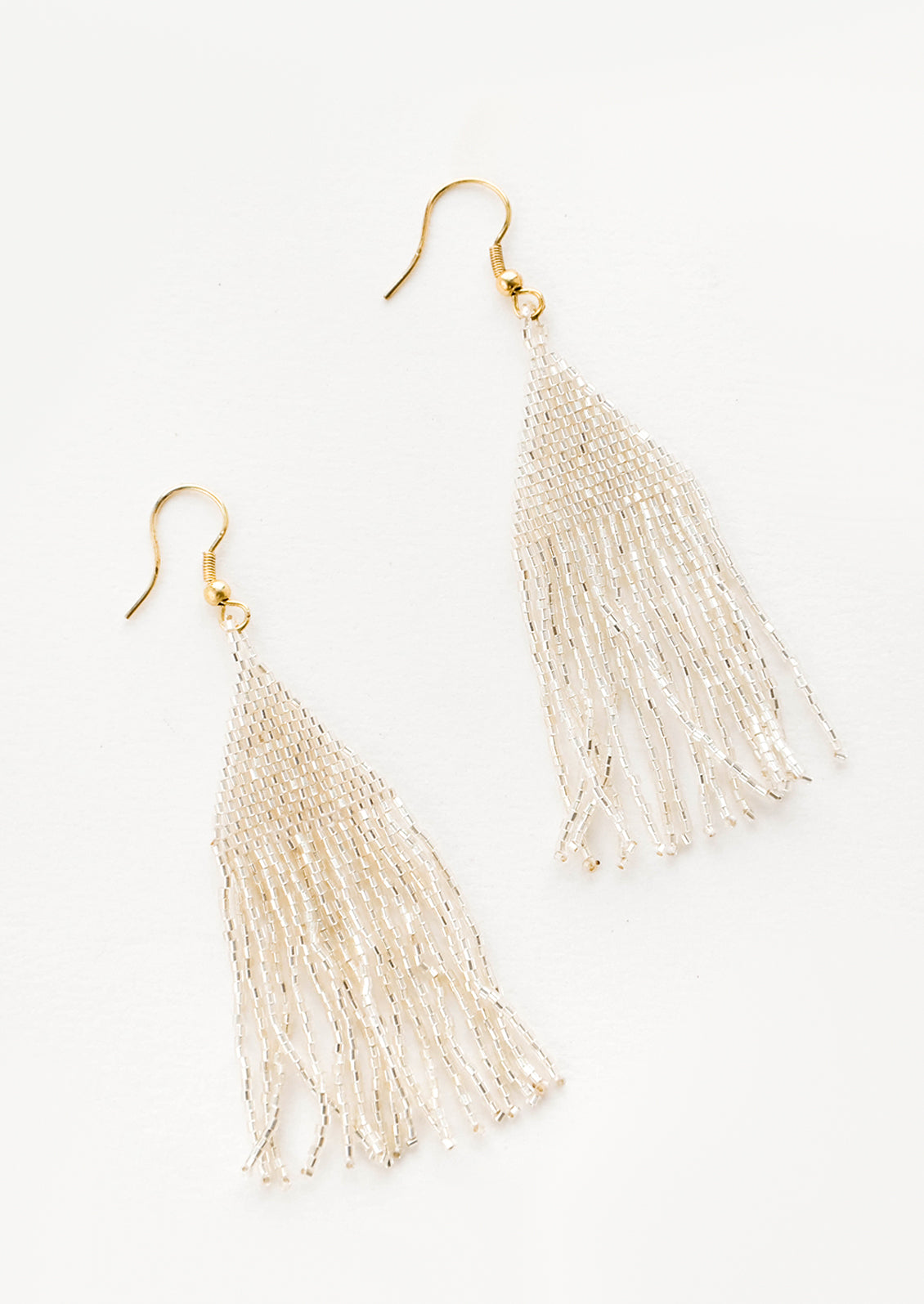 Metallic silver triangular fringe beaded earrings.