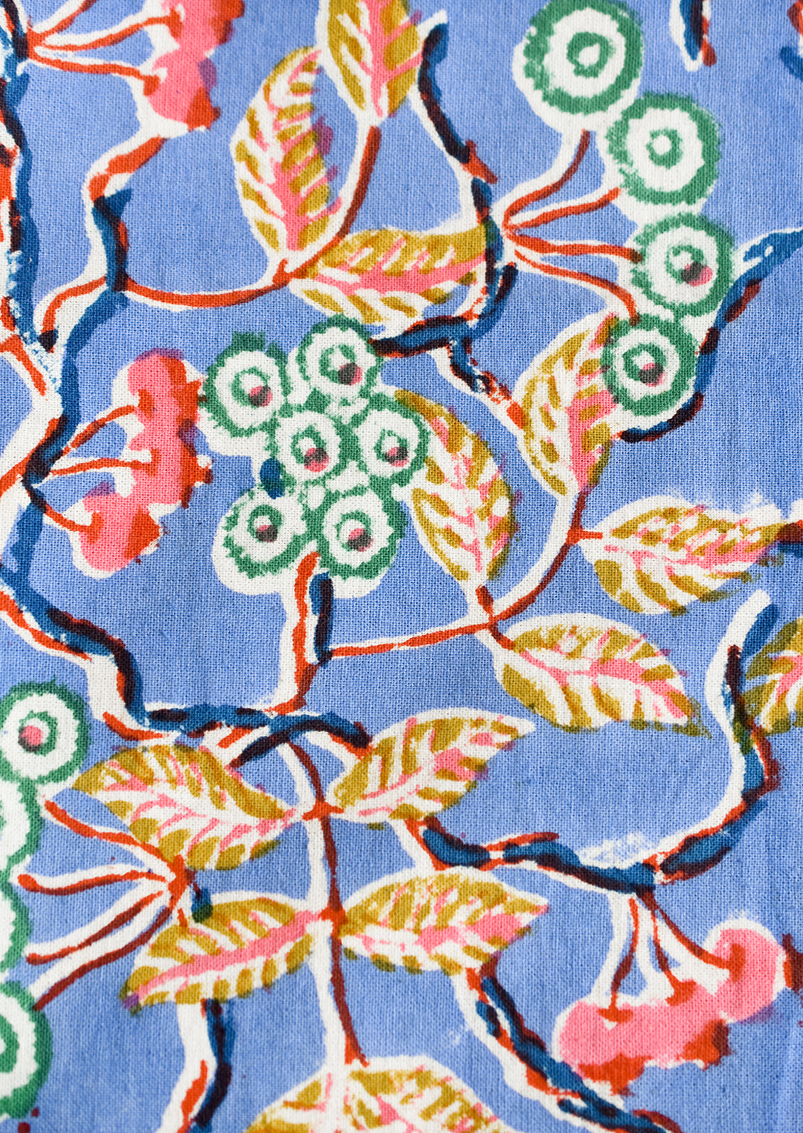 A block printed floral pattern with periwinkle background.