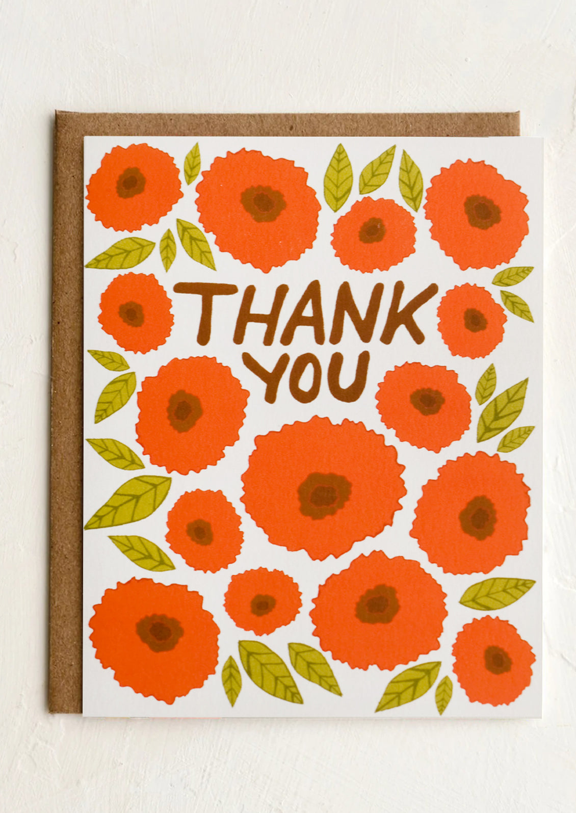 A red poppy print card reading "THANK YOU".