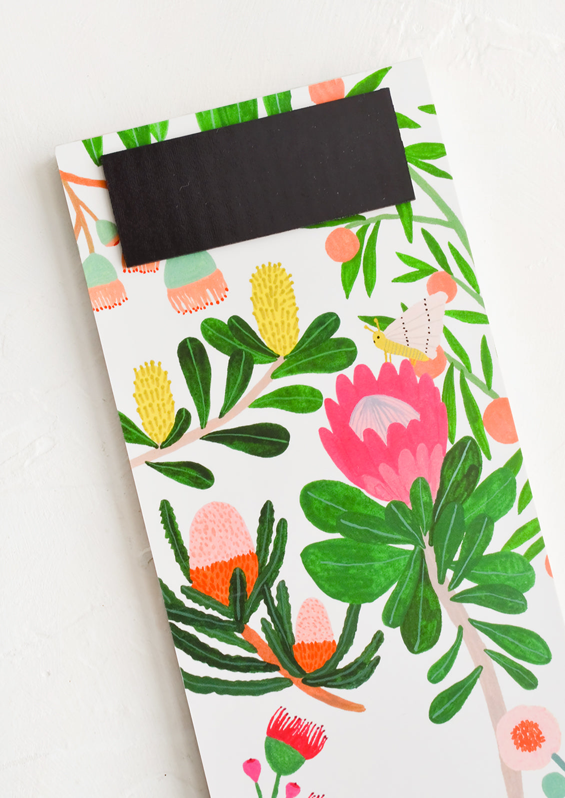 A floral print notepad with back magnet.