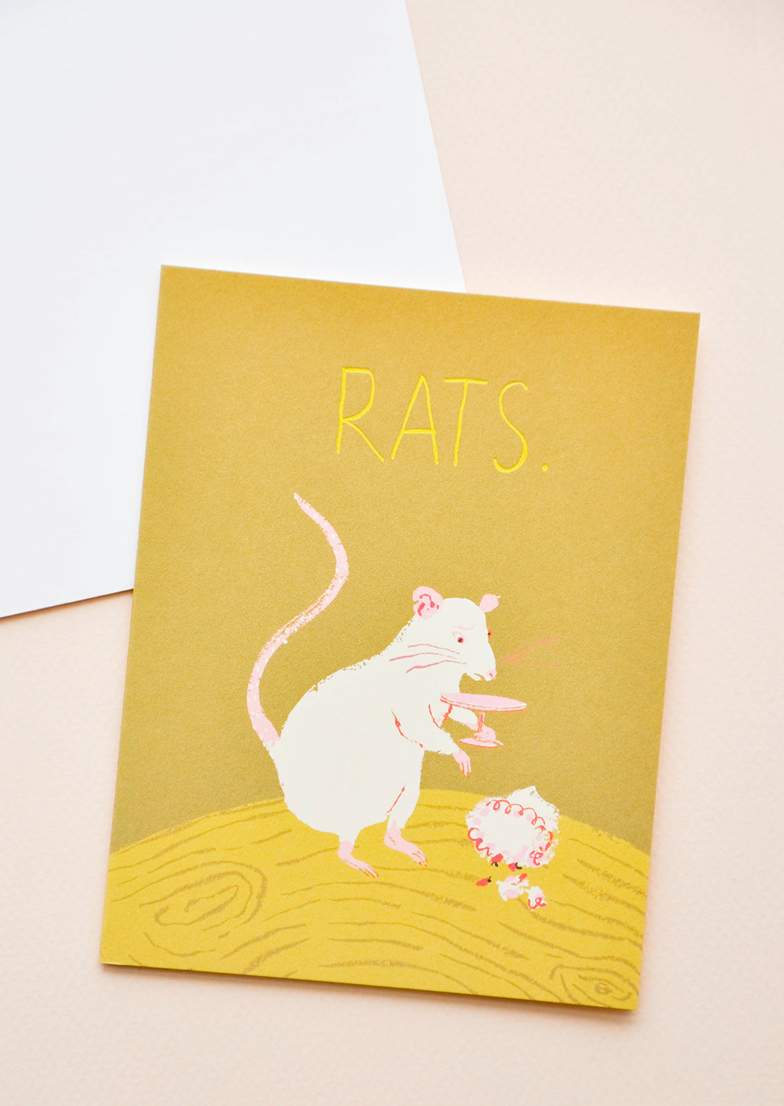 Yellow notecard with drawing of a rat and the text "Rats" with white envelope.