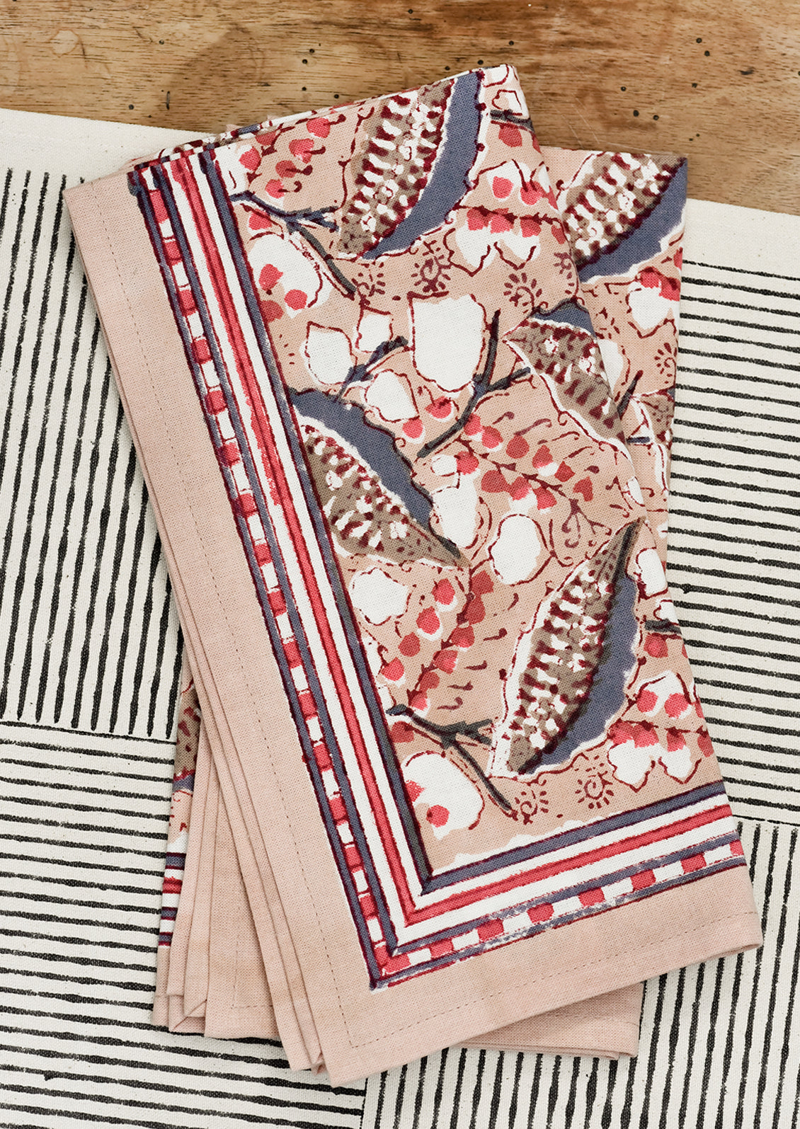 A pair of block printed napkins on a table.