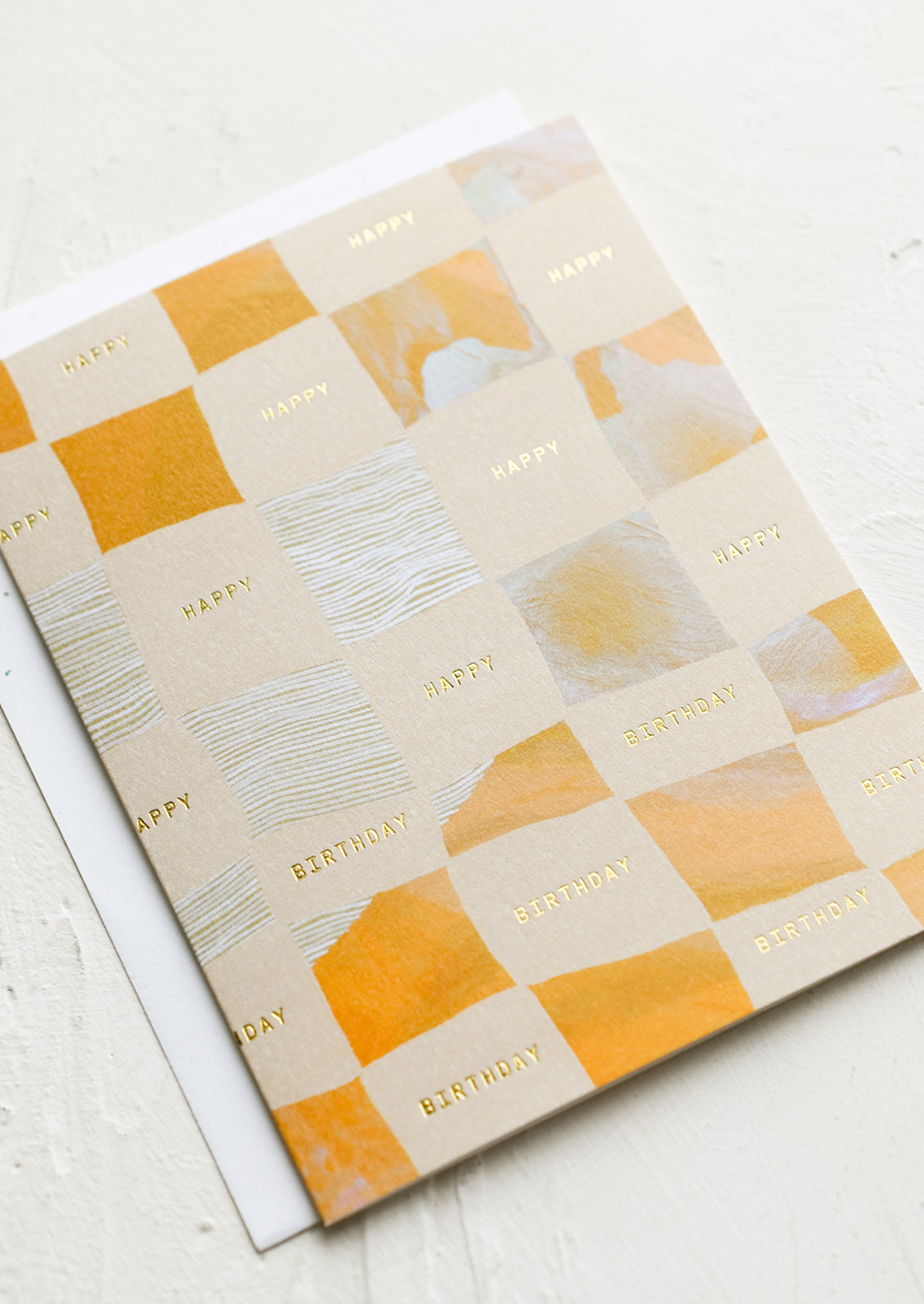 A birthday card with checker print.